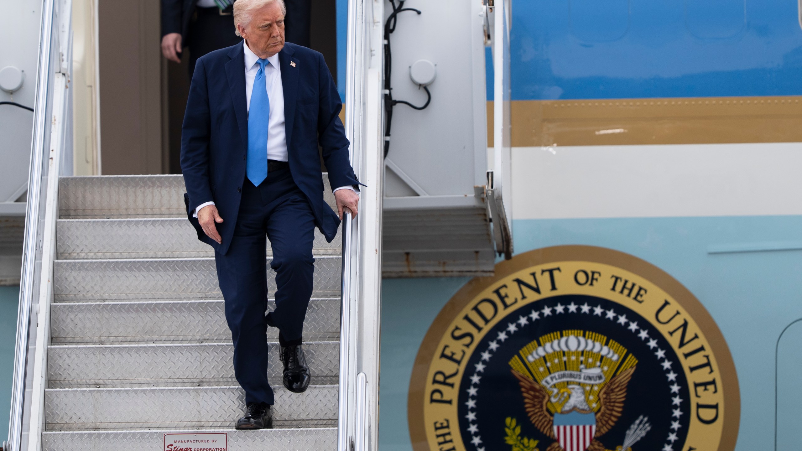 President Donald Trump arrives on Air Force One at Palm Beach International Airport, Friday, March 28, 2025, in West Palm Beach, Fla. (AP Photo/Manuel Balce Ceneta)