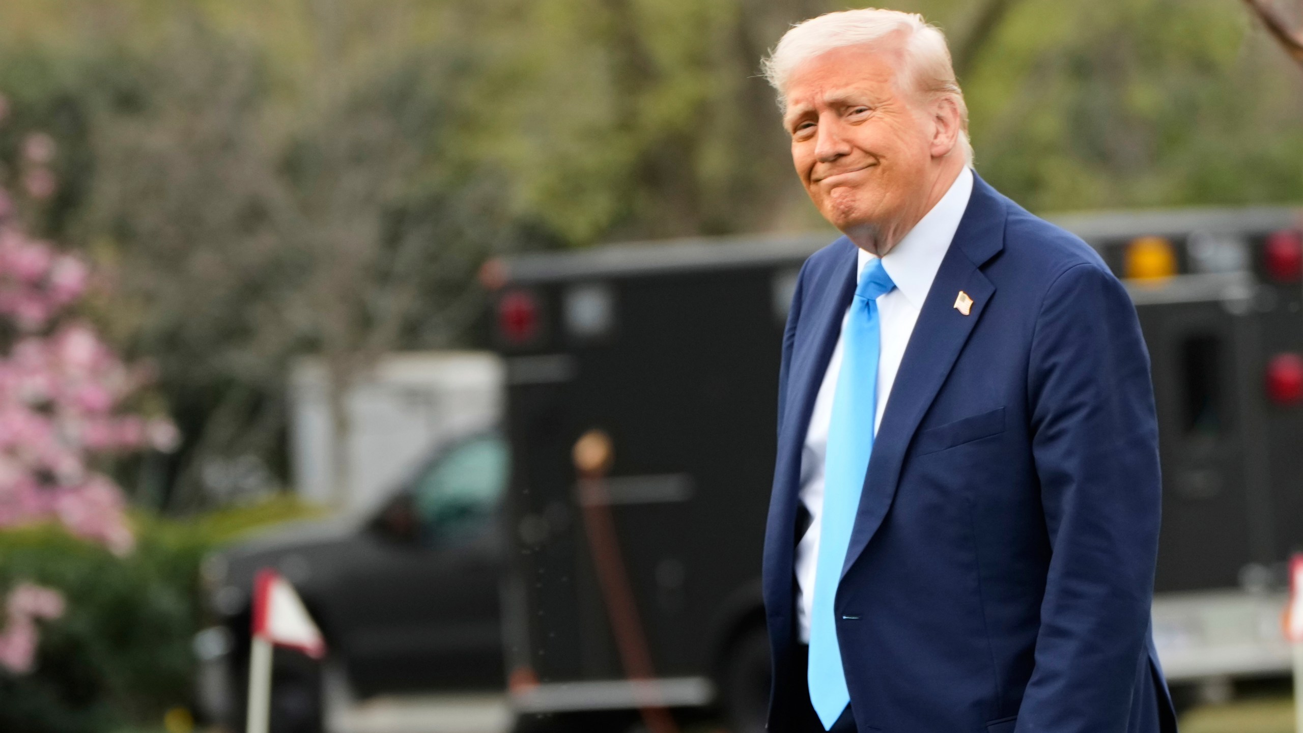 President Donald Trump walks from the Oval Office to board Marine One on the South Lawn of the White House en route to Florida, Friday, March 28, 2025, in Washington. (AP Photo/Mark Schiefelbein)