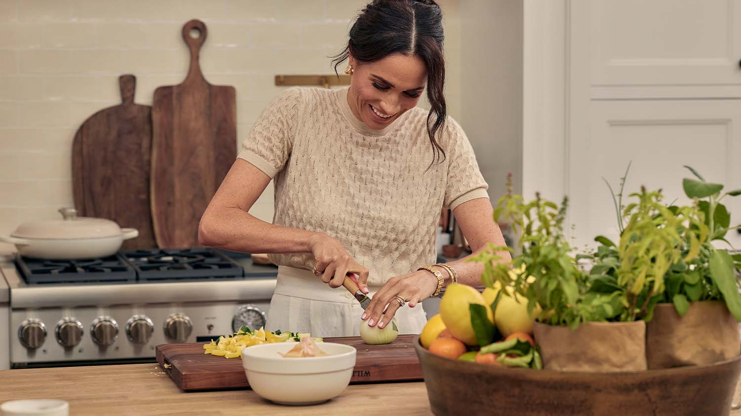 Meghan prepares a meal in a kitchen