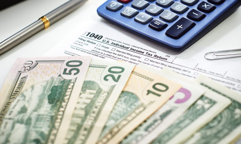 US currency with calculator