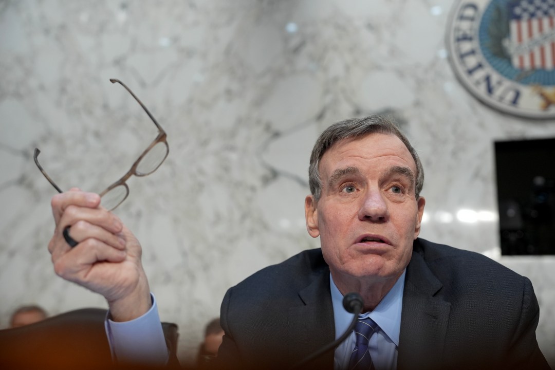 Sen. Mark Warner (D-VA) asks a question in the Senate.