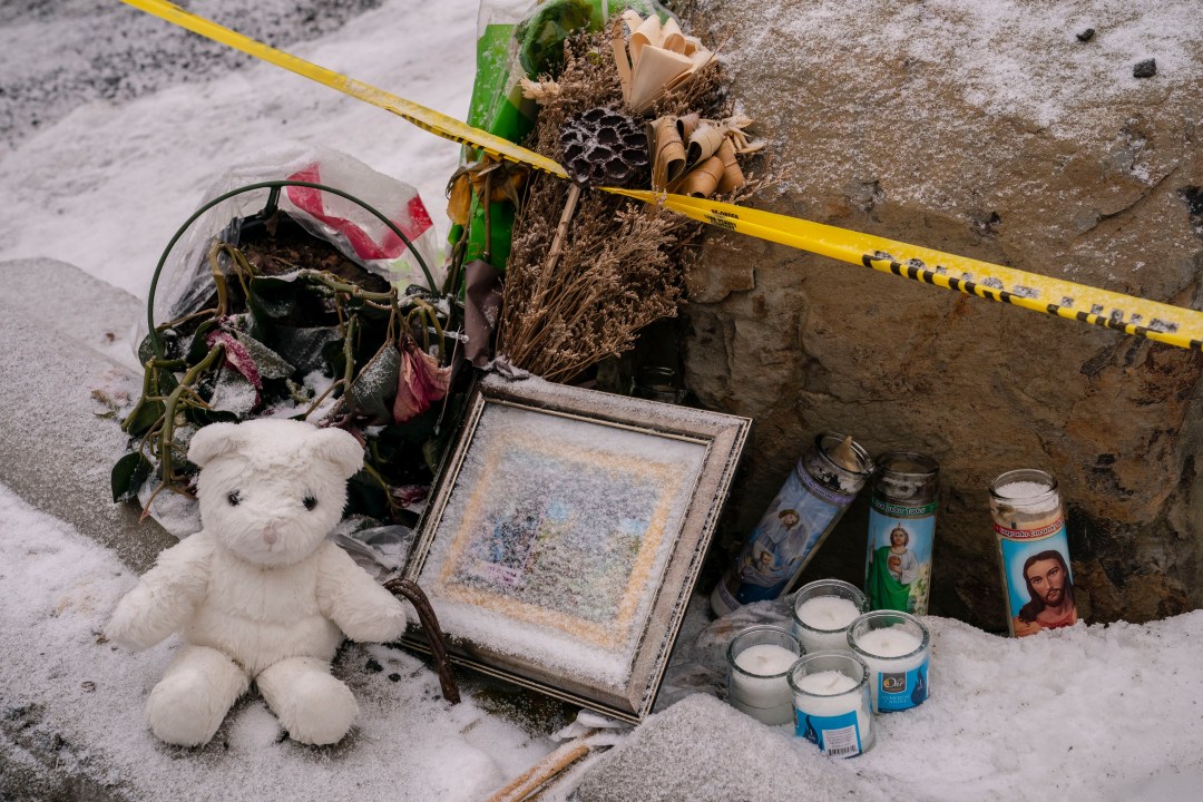 memorial with teddy bear and police tape at Idaho murder scene