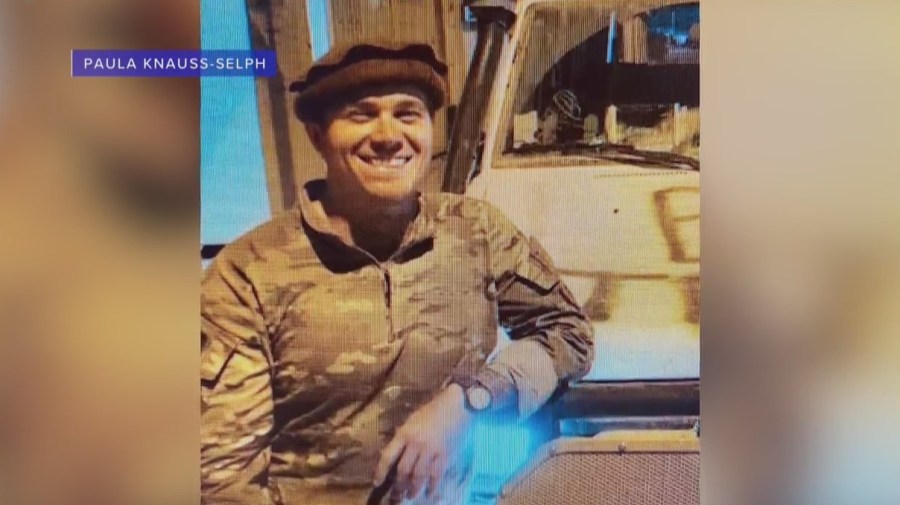 Ryan Knauss smiles for a photo in his uniform.