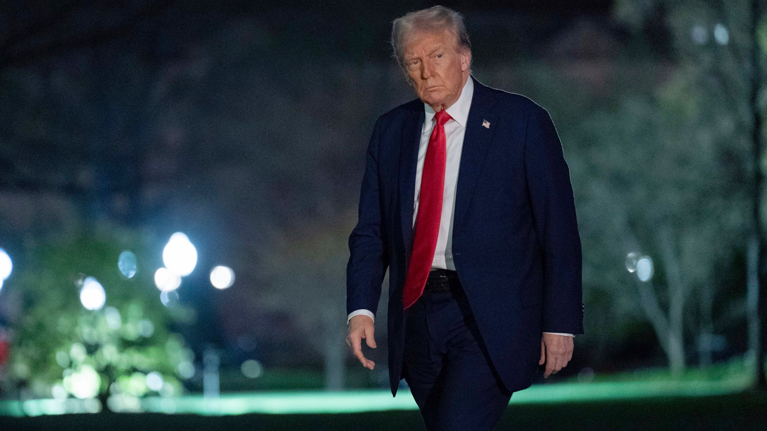 President Donald Trump walks on the South Lawn of the White House, in Washington, Sunday, March 30, 2025. (AP Photo/Jose Luis Magana)