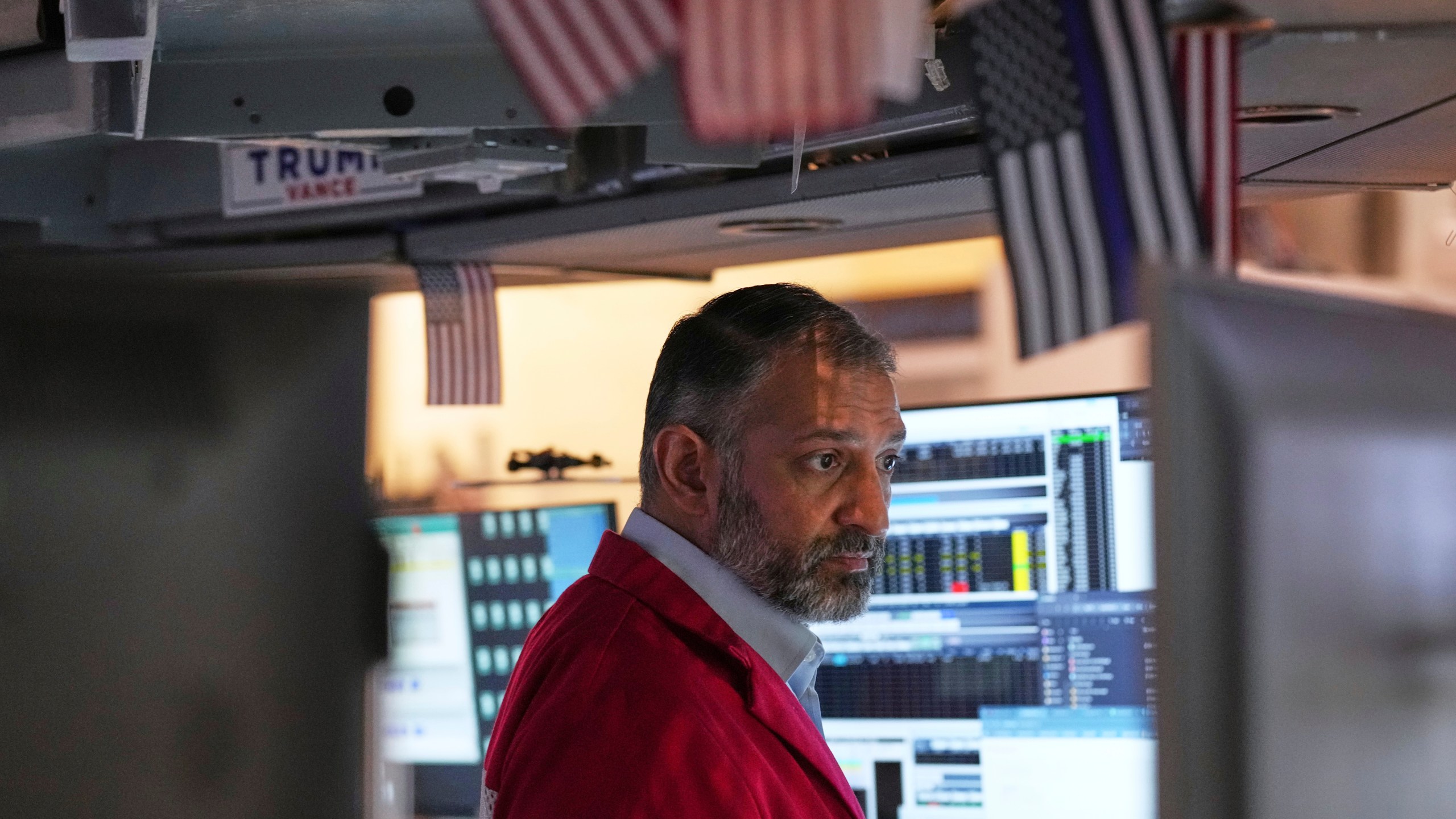 Aman Patel works on the floor at the New York Stock Exchange in New York, Thursday, April 3, 2025. (AP Photo/Seth Wenig)