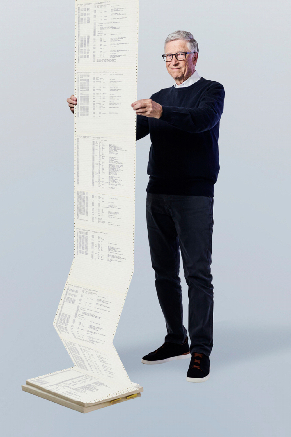 CORRECTS THAT PHOTO WAS TAKEN IN RECENT TIMES - This recent photo provided by Gates Ventures shows Microsoft founder Bill Gates holding a printout of the computer coding that launched the software maker in April 1975. (Ian Allen/Gates Ventures via AP)