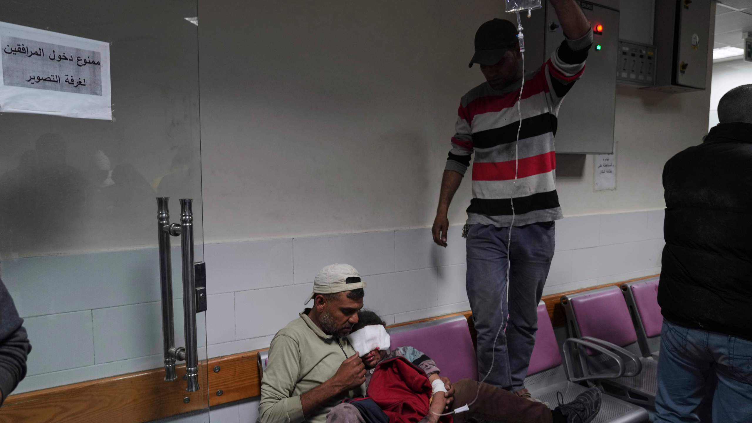 Palestinians who were injured in an Israeli airstrike, are brought for a treatment at the Baptist Hospital in Gaza City, on Thursday, April 3, 2025. (AP Photo/Jehad Alshrafi)
