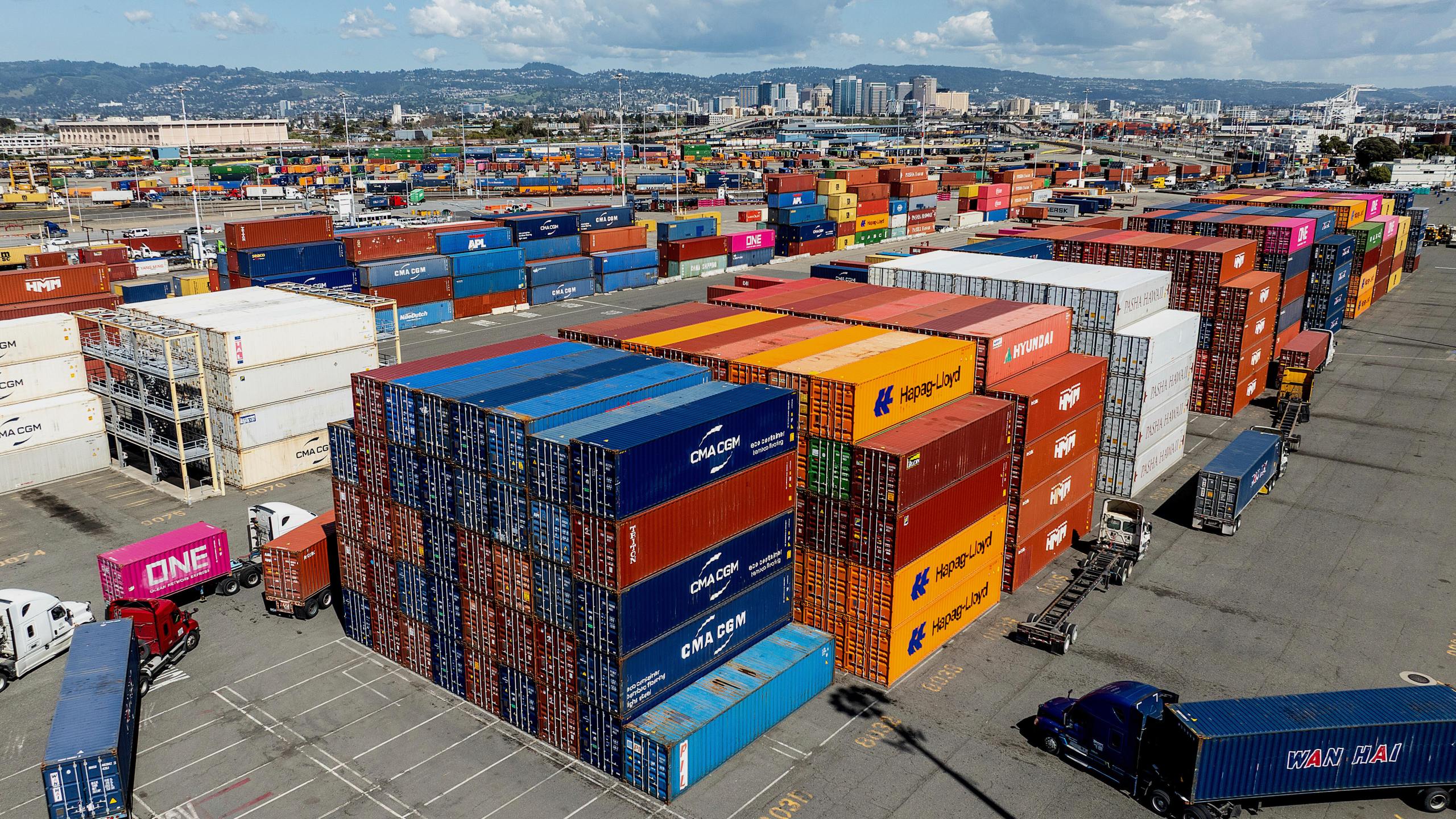 Cargo containers line a shipping terminal at the Port of Oakland on Thursday, April 3, 2025, in Oakland, Calif. (AP Photo/Noah Berger)