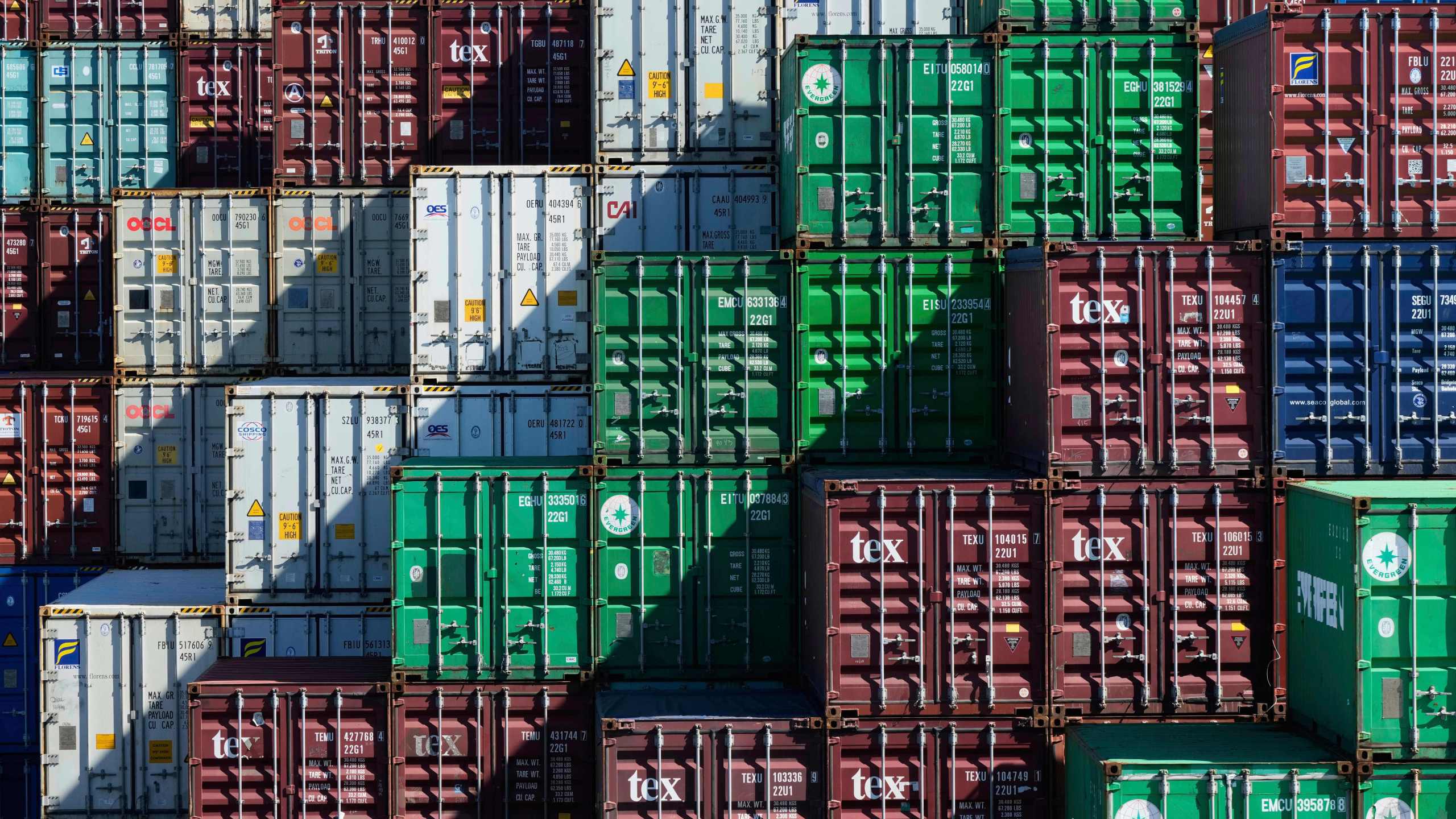 Shipping containers are stacked at Port Botany in Sydney, Australia, Monday, April 7, 2025. (AP Photo/Rick Rycroft)