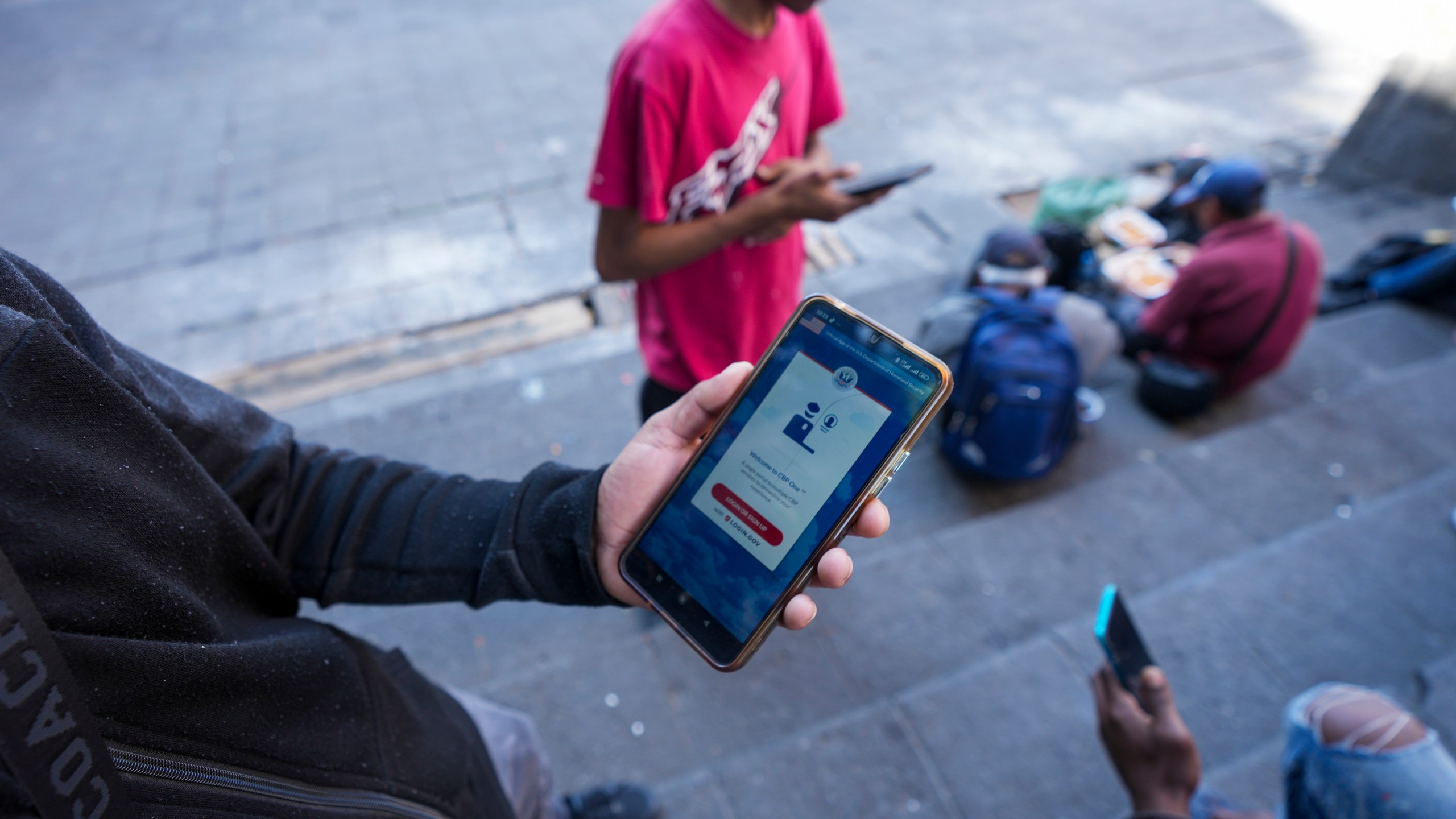 FILE - Venezuelan migrant Yender Romero shows the U.S. Customs and Border Protection (CBP) One app on his cell phone, which he said he used to apply for asylum in the U.S. and is waiting on an answer, at a migrant tent camp outside La Soledad church in Mexico City, Jan. 20, 2025. (AP Photo/Fernando Llano, File)
