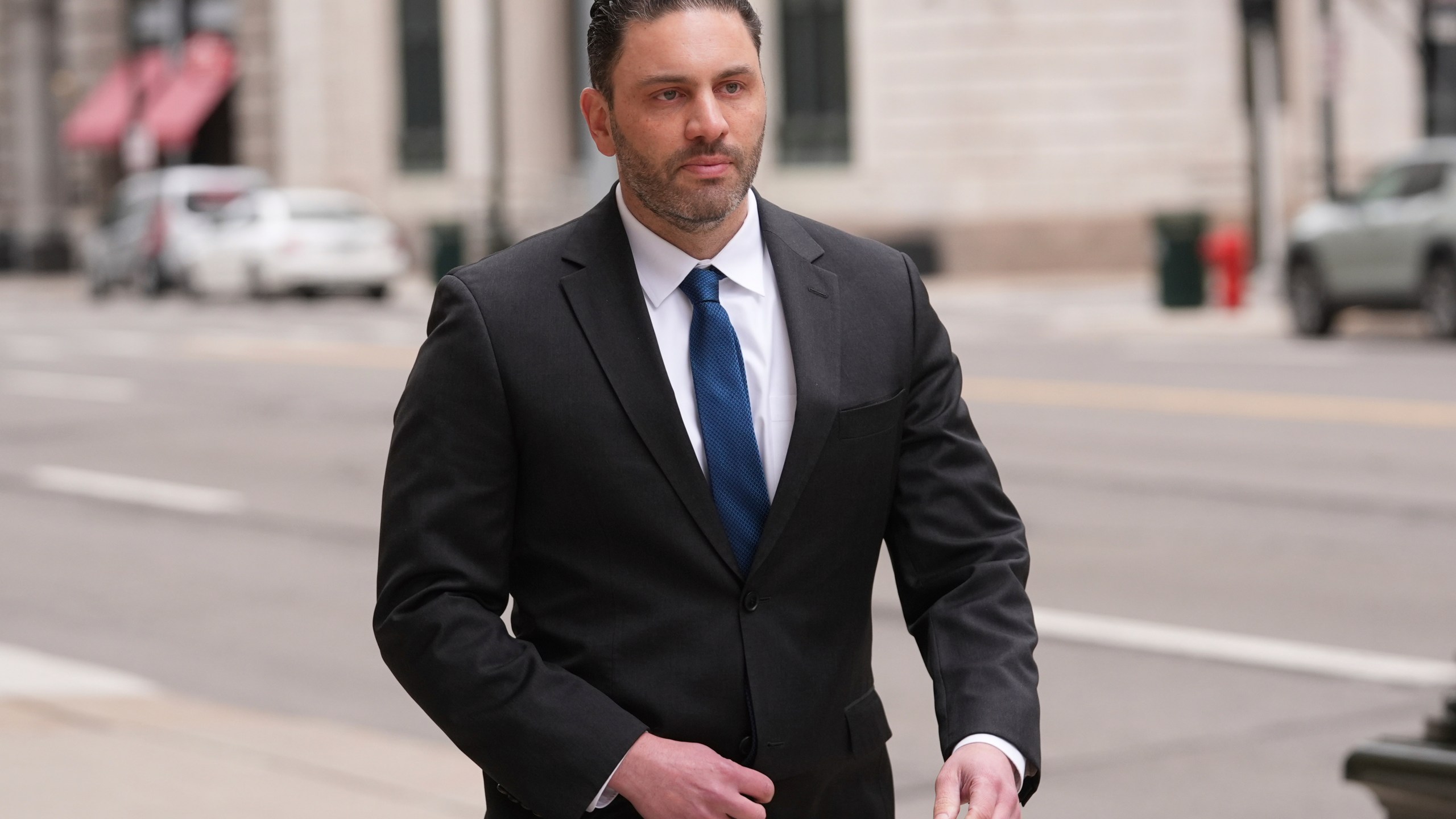 Former NFL and University of Michigan assistant football coach Matt Weiss leaves federal court in Detroit, Monday, March 24, 2025. (AP Photo/Paul Sancya)