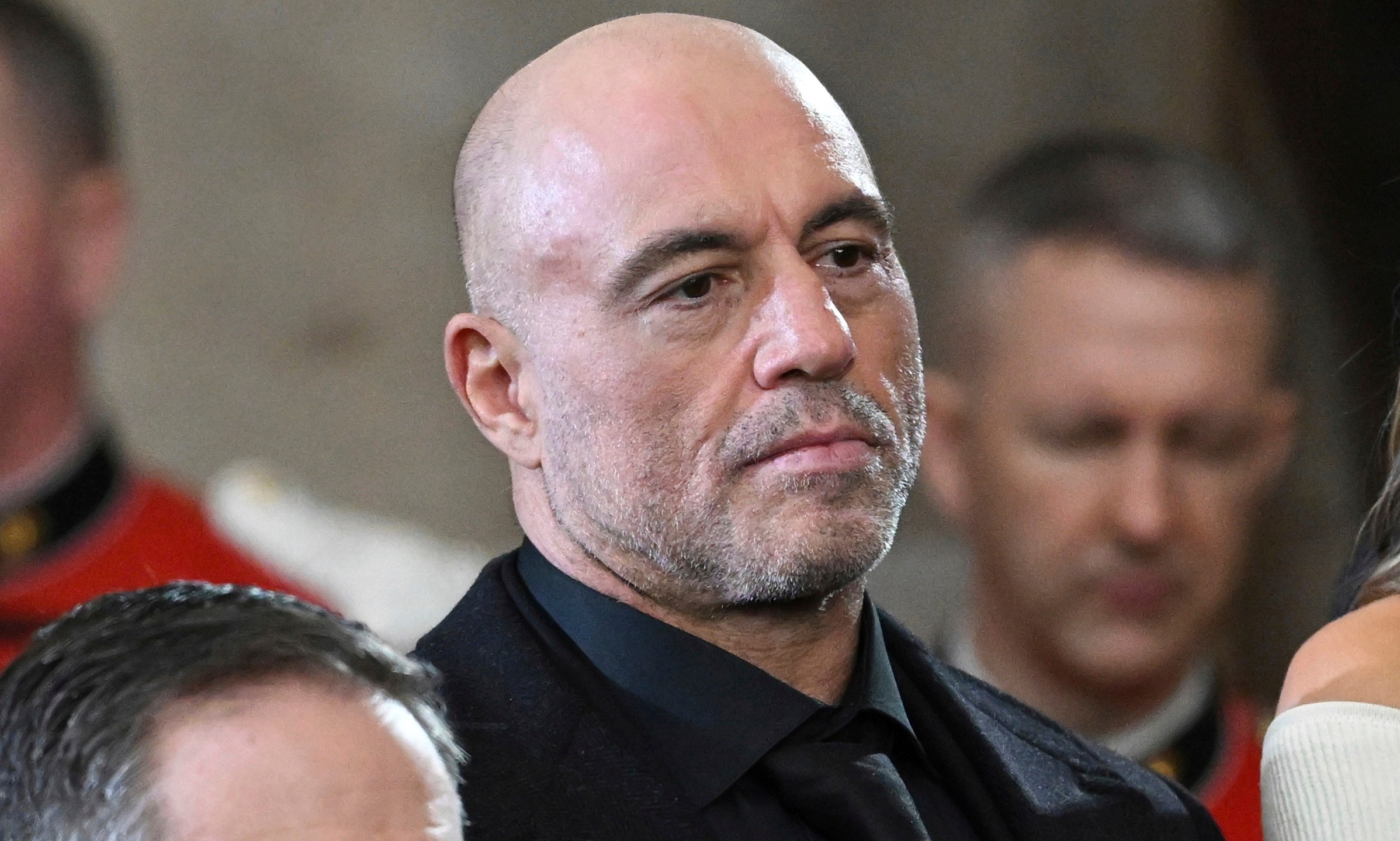 FILE - Joe Rogan stands for a benediction after President Donald Trump was sworn in during the 60th Presidential Inauguration in the Rotunda of the U.S. Capitol in Washington, Jan. 20, 2025. (Saul Loeb/Pool photo via AP, File)