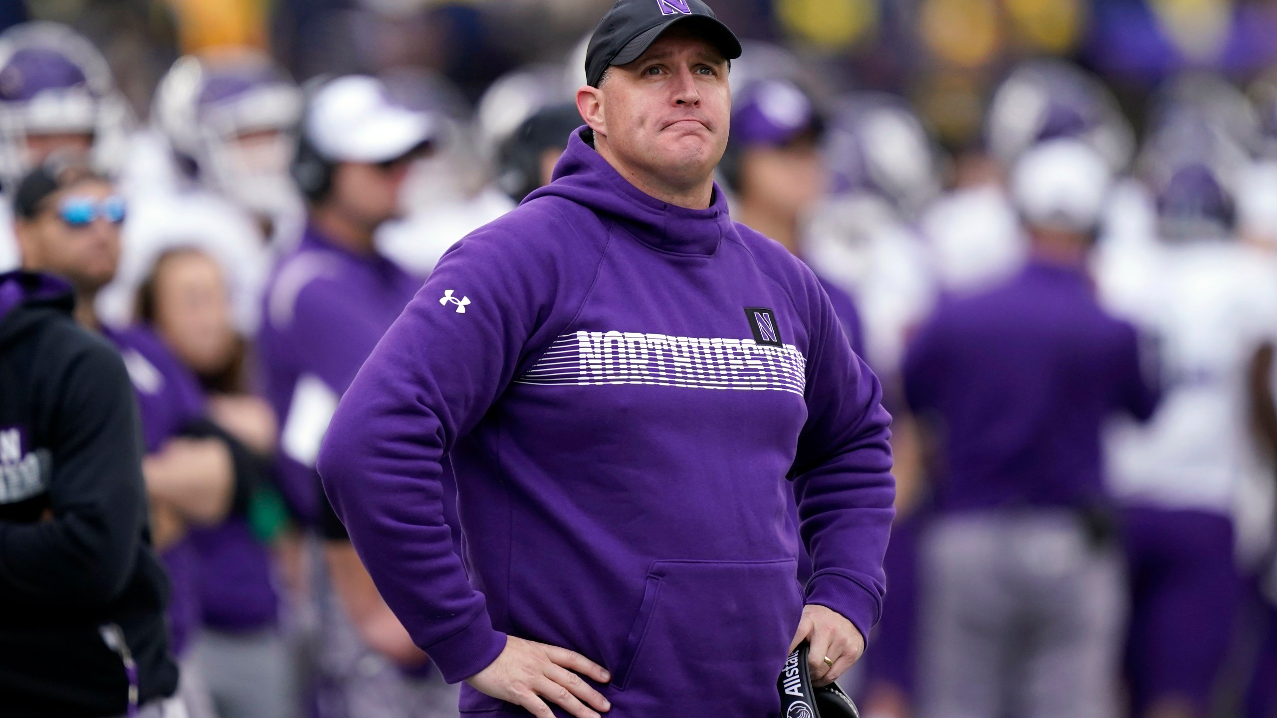 FILE - Northwestern head coach Pat Fitzgerald stands on the sideline during the first half of an NCAA college football game against Michigan, Oct. 23, 2021, in Ann Arbor, Mich. (AP Photo/Carlos Osorio, File)