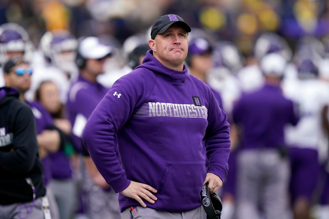 FILE - Northwestern head coach Pat Fitzgerald stands on the sideline during the first half of an NCAA college football game against Michigan, Oct. 23, 2021, in Ann Arbor, Mich. (AP Photo/Carlos Osorio, File)