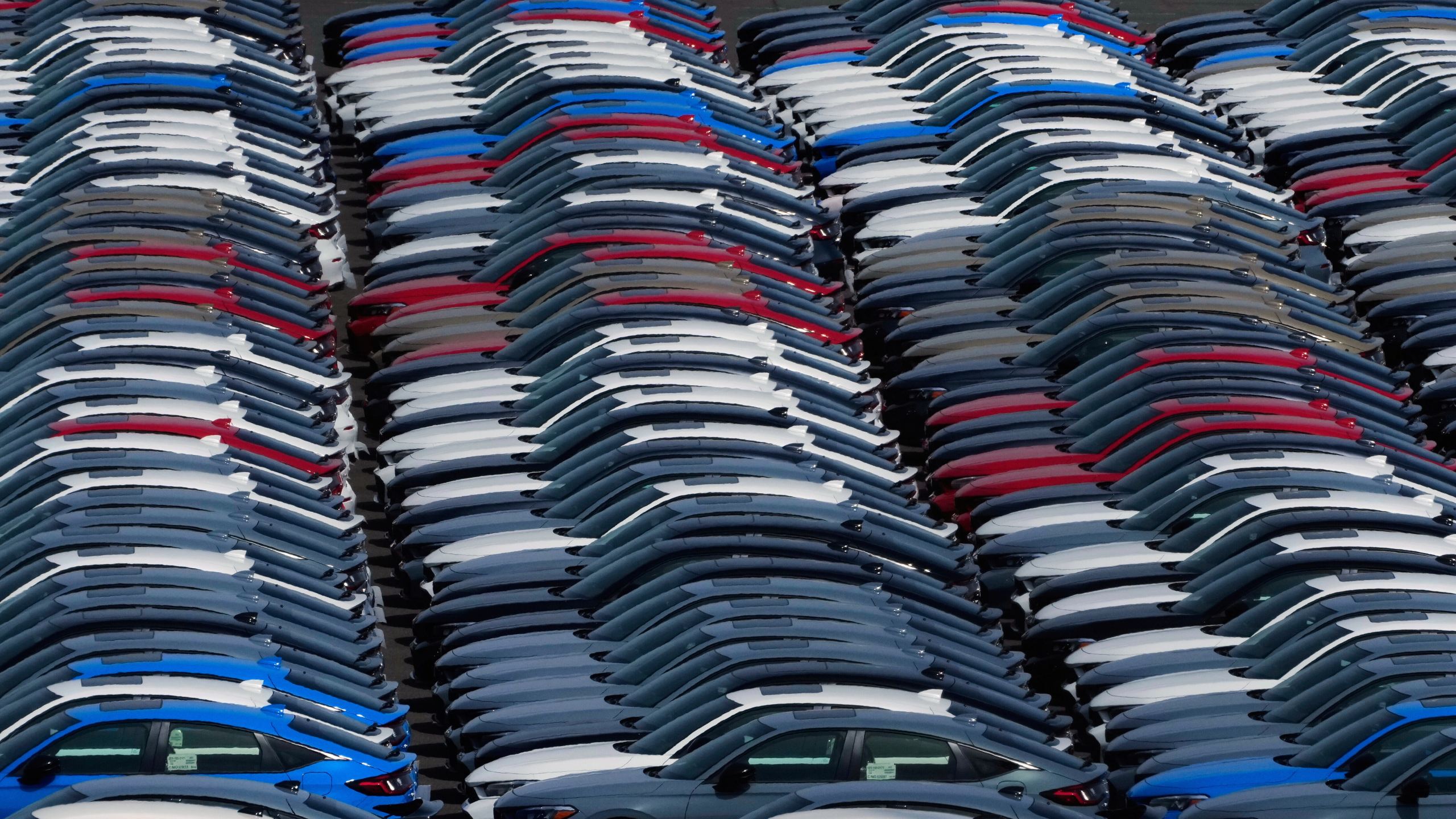 Export vehicles are parked at Daikoku Pier in Yokohama, near Tokyo, Tuesday, April 8, 2025. (AP Photo/Hiro Komae)
