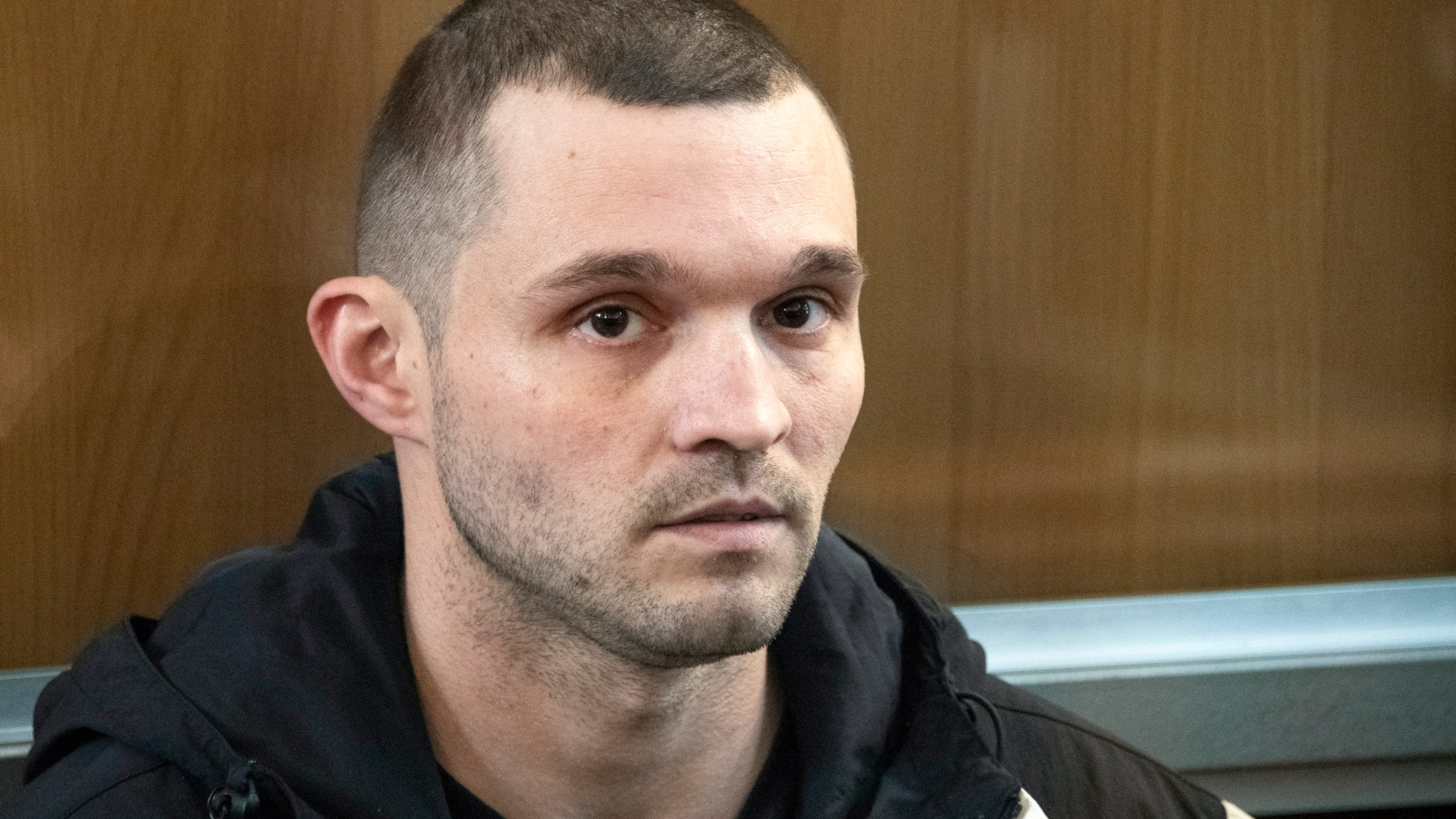 FILE - U.S. Army Staff Sgt. Gordon Black sits in a glass cage in courtroom in Vladivostok, Russia, on June 6, 2024. (AP Photo, File)