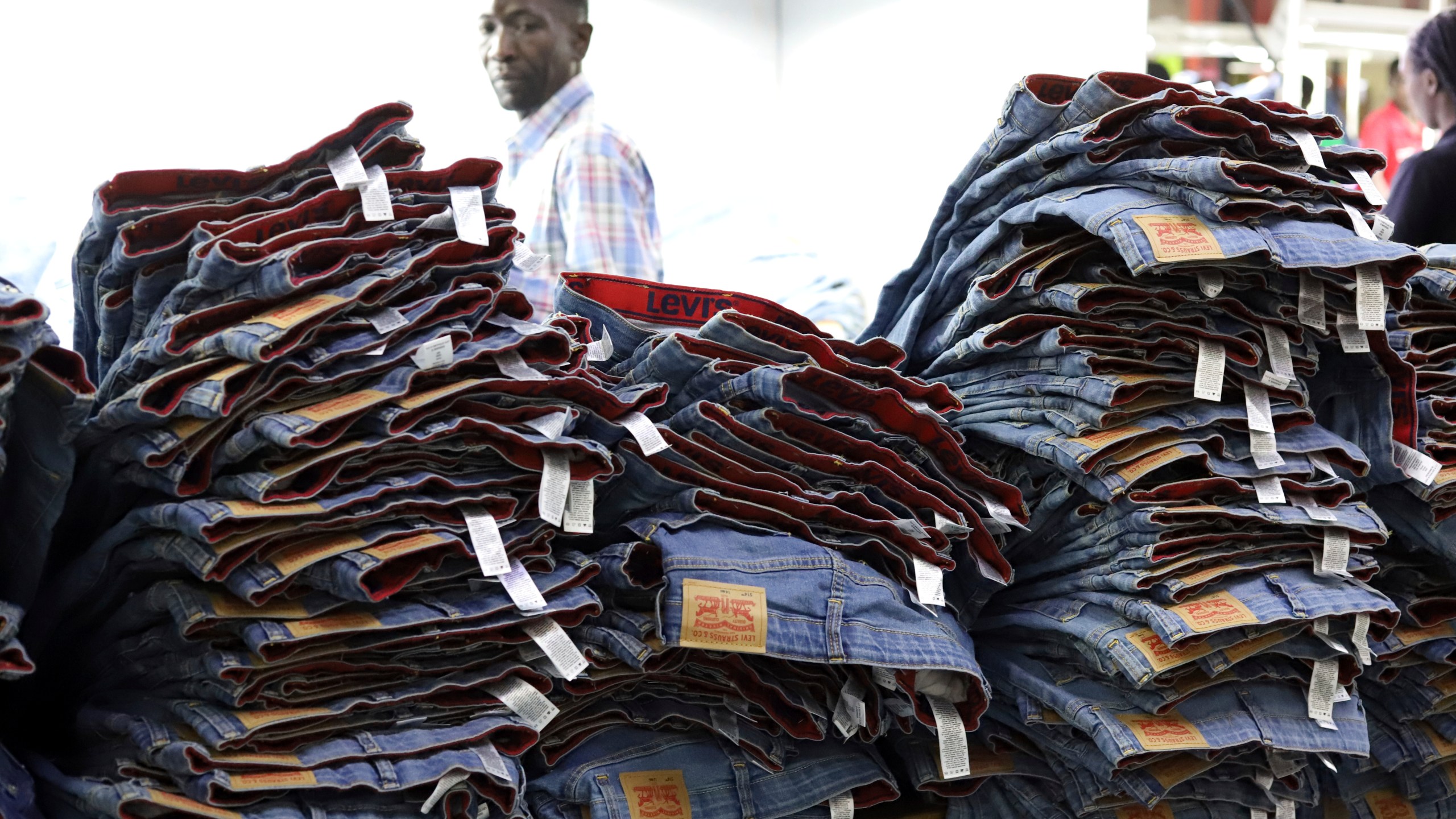 A label reading "Levis" on a pair of Levi Strauss & Co jeans are displayed at a production line at United Aryan EPZ Limited in Ruaraka on the outskirts of Nairobi, Kenya Friday, March. 21, 2025. (AP Photo/Andrew Kasuku)