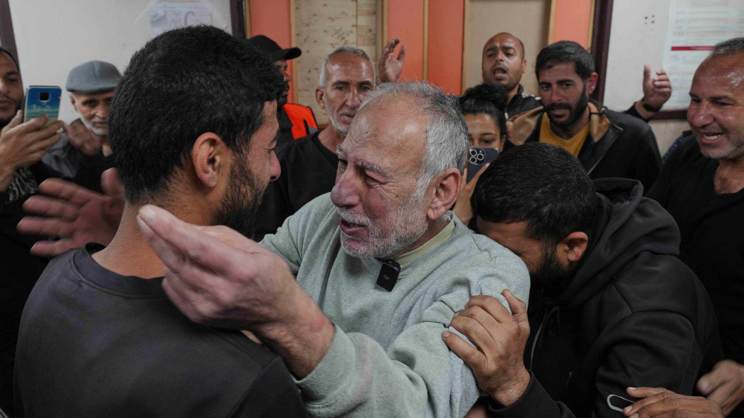 Freed Palestinian prisoner Jamal Zuweiri, 69, center, is welcomed upon arrival at al-Aqsa Hospital in Deir al-Balah, central Gaza Strip, after being released from an Israeli prison, Thursday, April 10, 2025. (AP Photo/Abdel Kareem Hana)