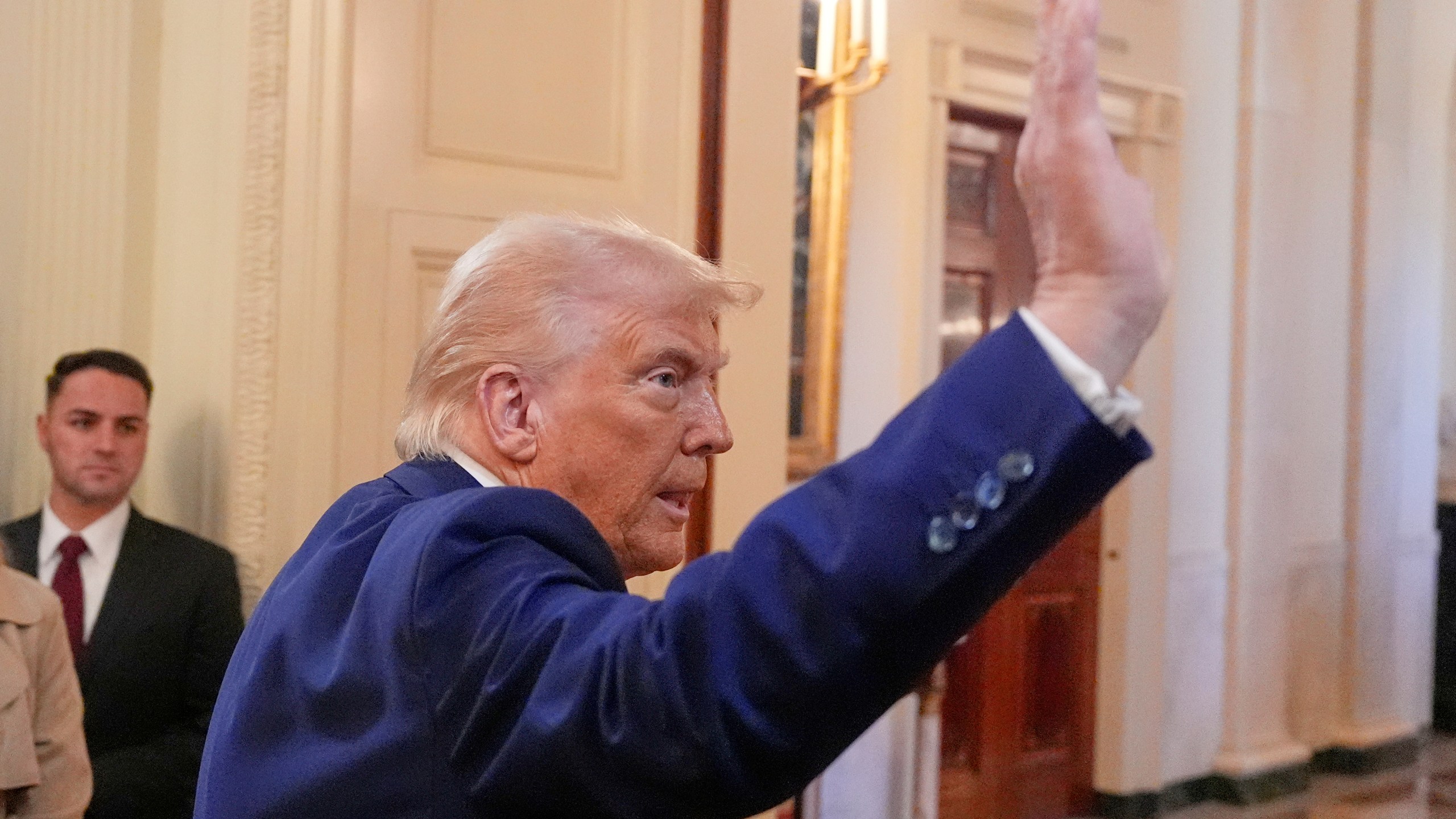 President Donald Trump departs after an event in the East Room of the White House, Tuesday, April 8, 2025, in Washington. (AP Photo/Alex Brandon)