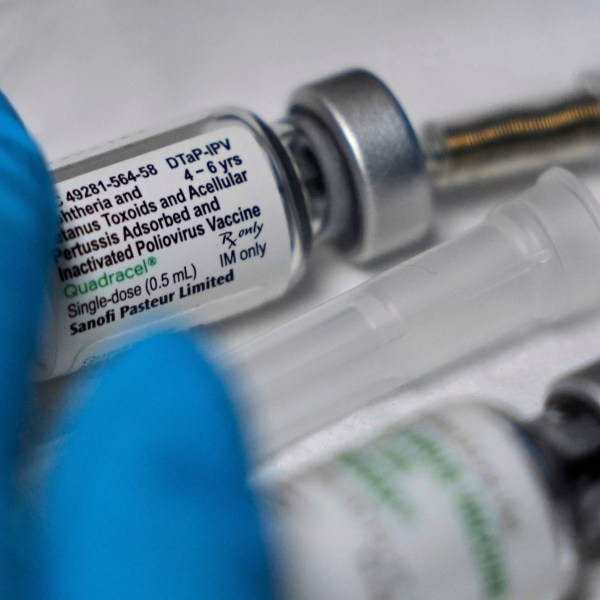 A vaccination that includes a polio dose is prepared for a child at the Dallas County Health and Human Services immunization clinic in Dallas, Friday, April 4, 2025. (AP Photo/LM Otero)