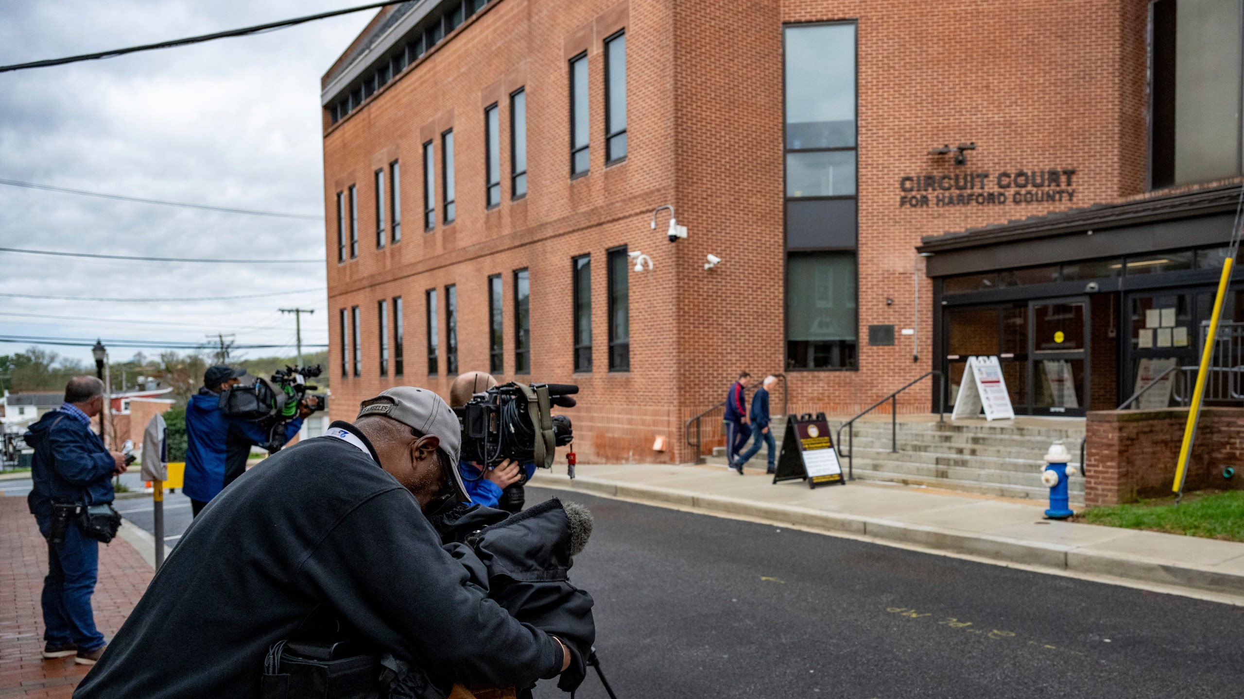 Media members set up outside the Harford County Circuit Courthouse for the opening statements in the trial of Victor Martinez-Hernandez, accused of killing Rachel Morin on Friday, April 4, 2025 in Bel Air, Md. ( Jerry Jackson/The Baltimore Banner via AP)