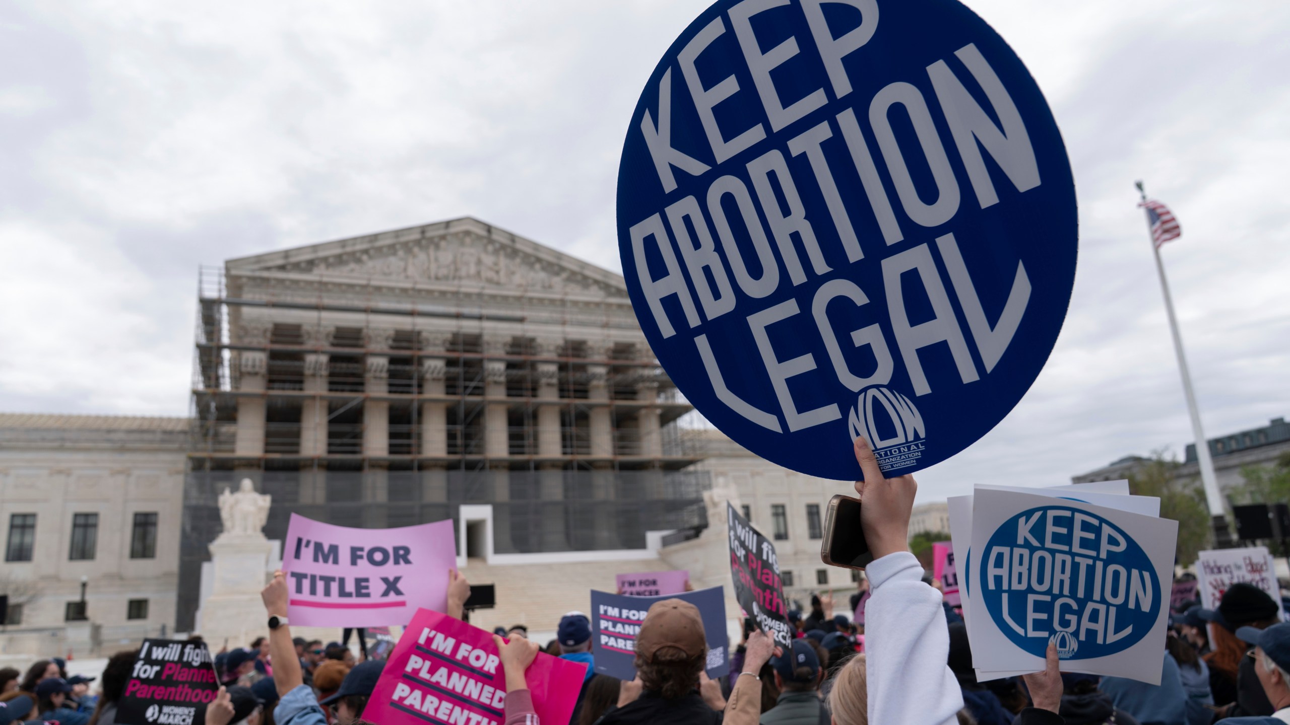 People rally outside the surpreme court
