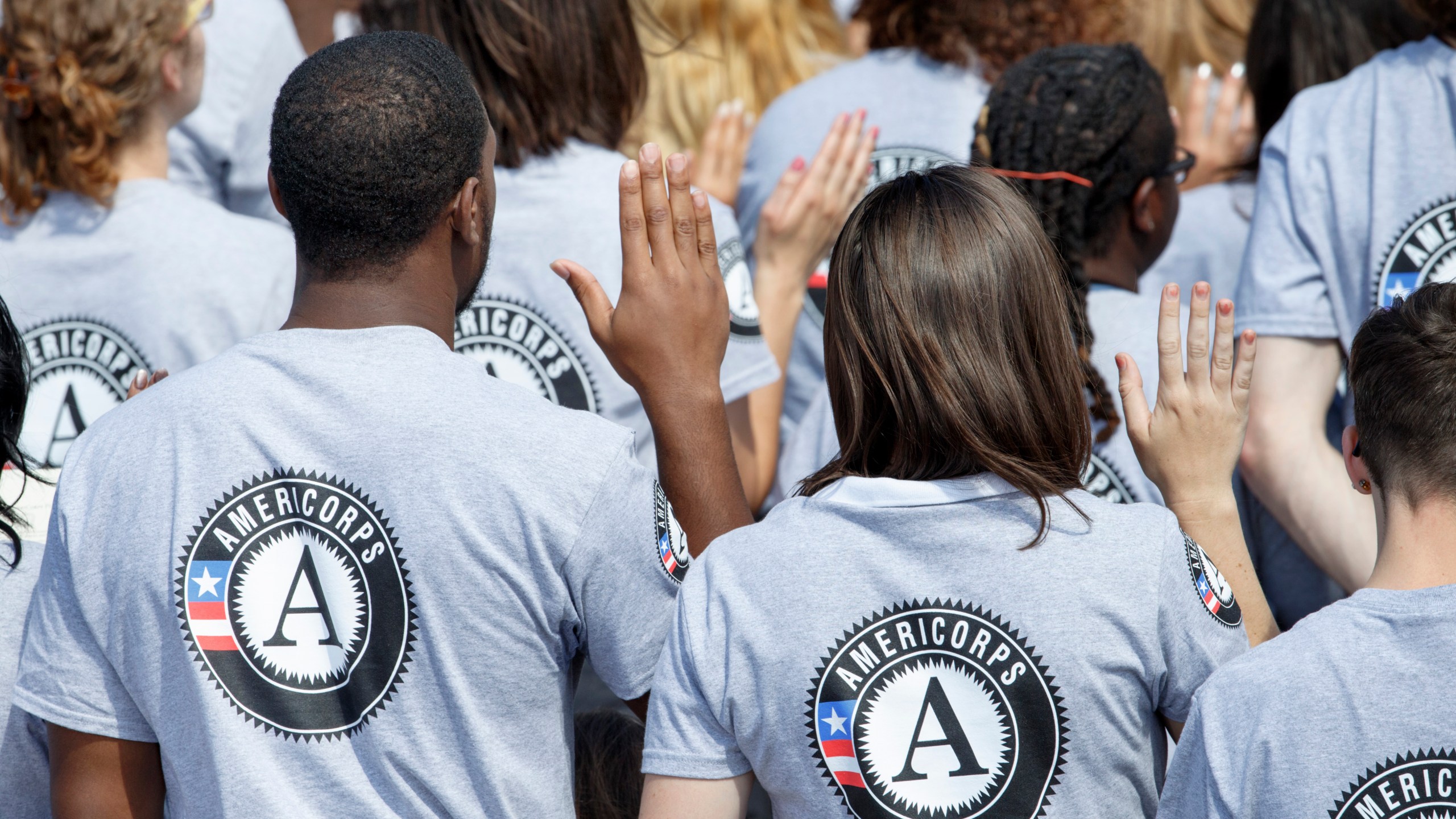 FILE - As President Barack Obama and former President Bill Clinton mark the 20th anniversary of the AmeriCorps national service program, hundreds of new volunteers are sworn in for duty at a ceremony, Friday, Sept. 12, 2014, on the South Lawn of the White House in Washington. (AP Photo/J. Scott Applewhite, file)