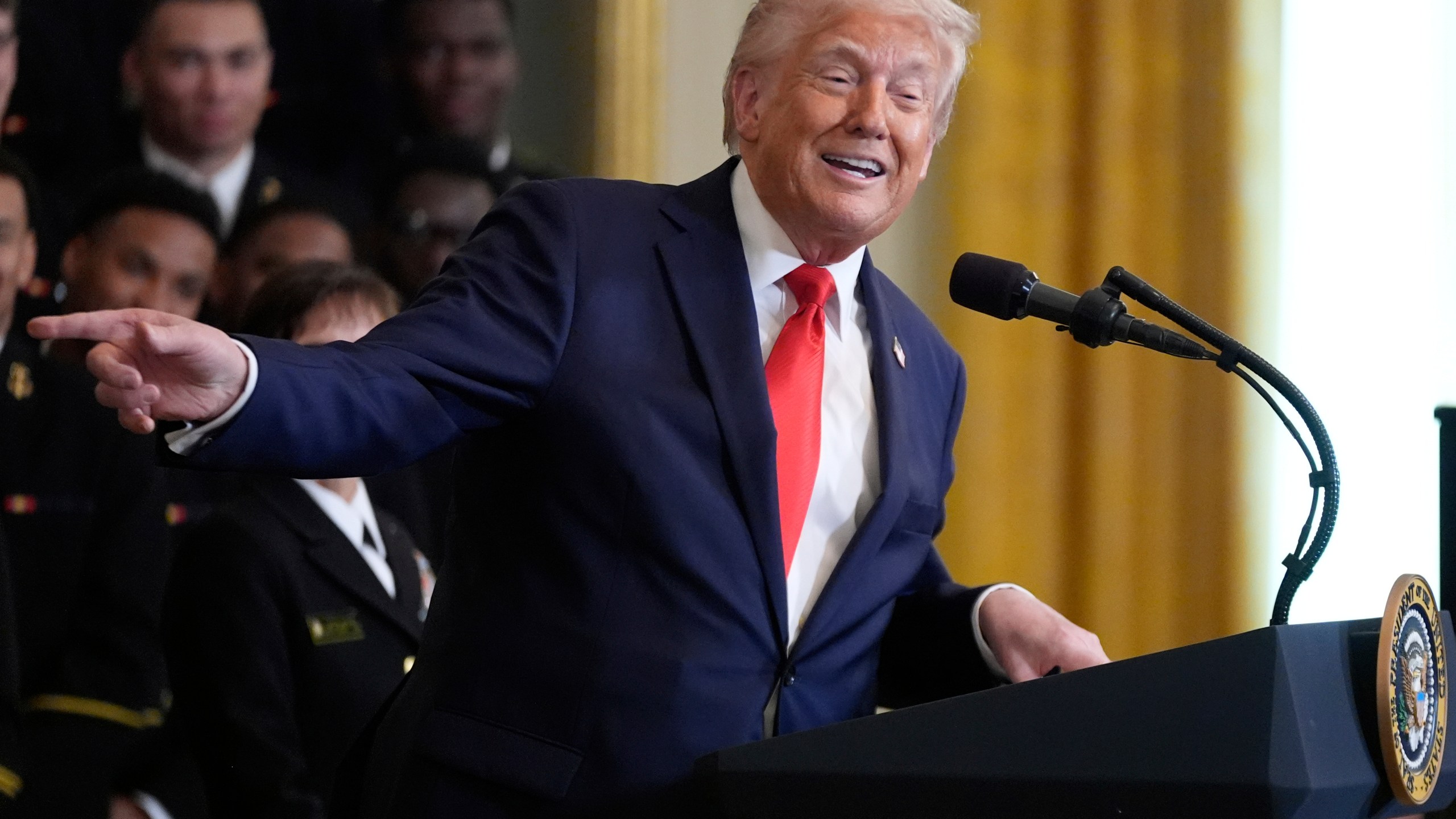 President Donald Trump speaks during the Commander-in-Chief trophy presentation to the Navy Midshipman football team in the East Room of the White House, Tuesday, April 15, 2025, in Washington. (AP Photo/Manuel Balce Ceneta)