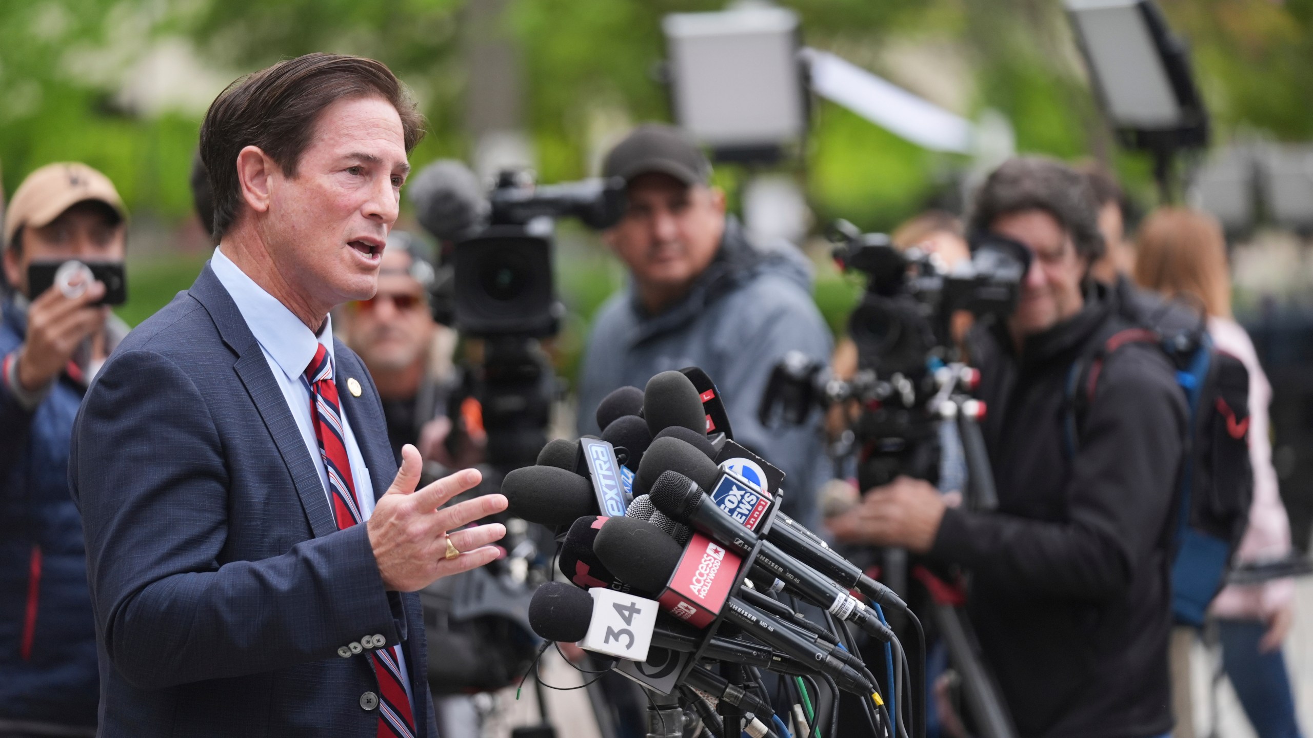 Los Angeles County District Attorney Nathan Hochman speaks outside of court before a hearing in the case of Erik and Lyle Menendez Thursday, April 17, 2025, in Los Angeles. (AP Photo/Damian Dovarganes)