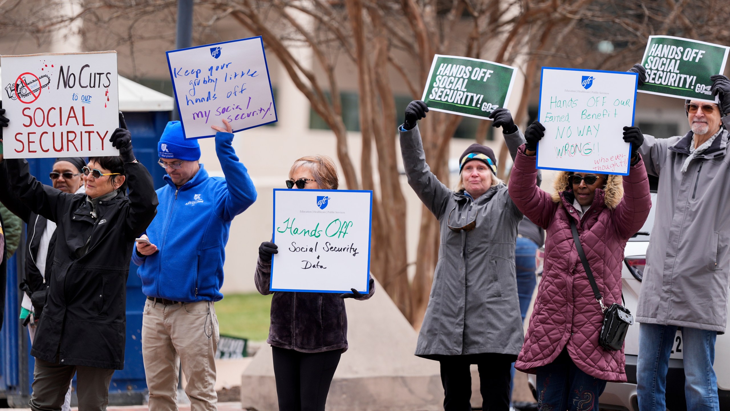 FILE - Demonstrators gather outside of the Edward A. Garmatz United States District Courthouse in Baltimore, on Friday, March 14, 2025, before a hearing regarding the Department of Government Efficiency's access to Social Security data. (AP Photo/Stephanie Scarbrough, File)