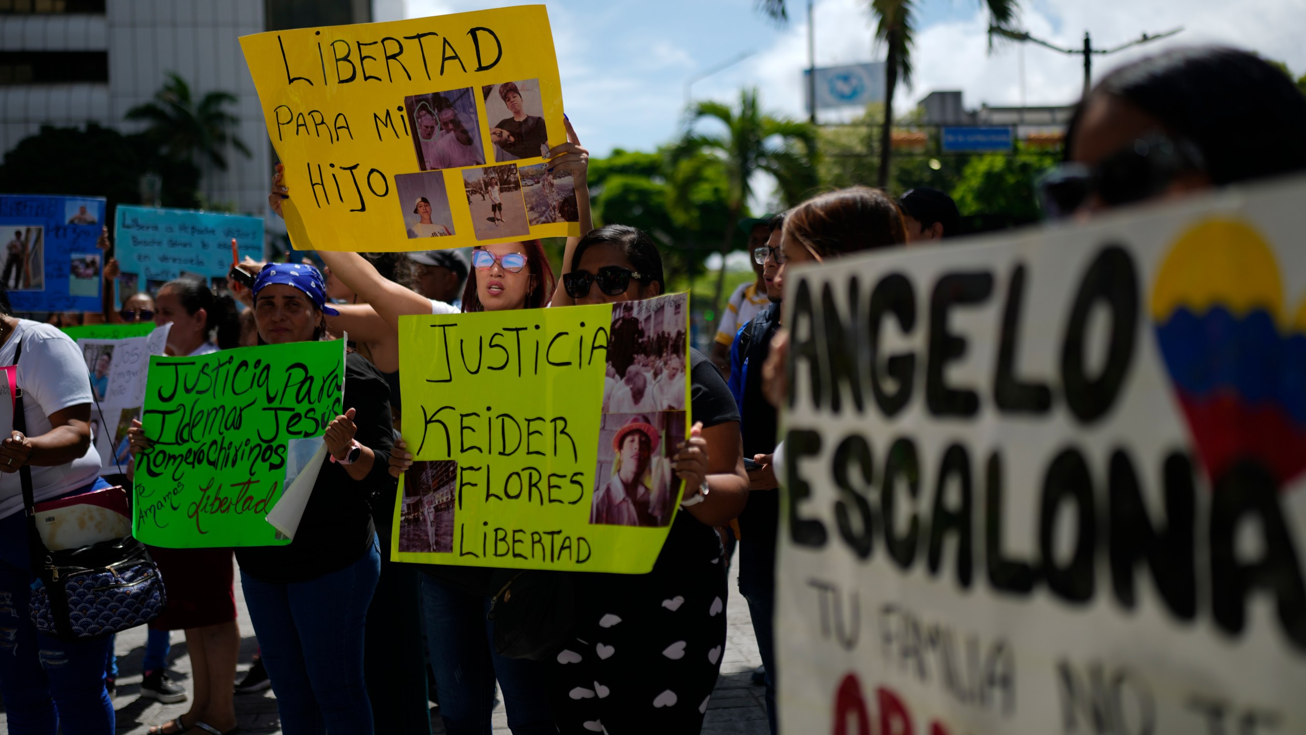 The relatives of Venezuelan migrants in the U.S. who were flown to a prison in El Salvador by the U.S. government who alleged they were members of the Tren de Aragua gang, protest outside of the United Nations building in Caracas, Venezuela, Wednesday, April 9, 2025. (AP Photo/Ariana Cubillos)