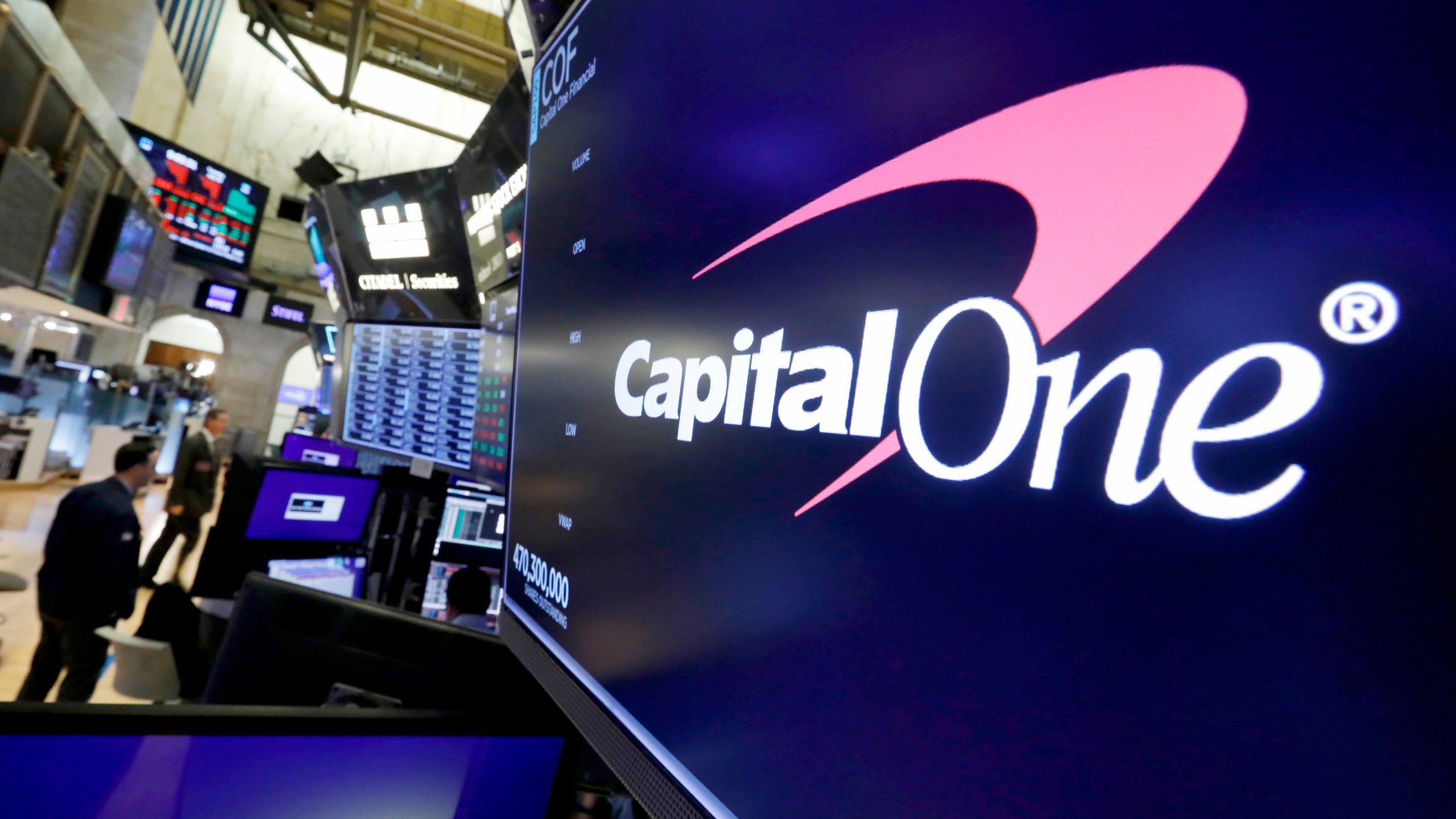 FILE - The logo for Capital One Financial is displayed above a trading post on the floor of the New York Stock Exchange, July 30, 2019. (AP Photo/Richard Drew, File)