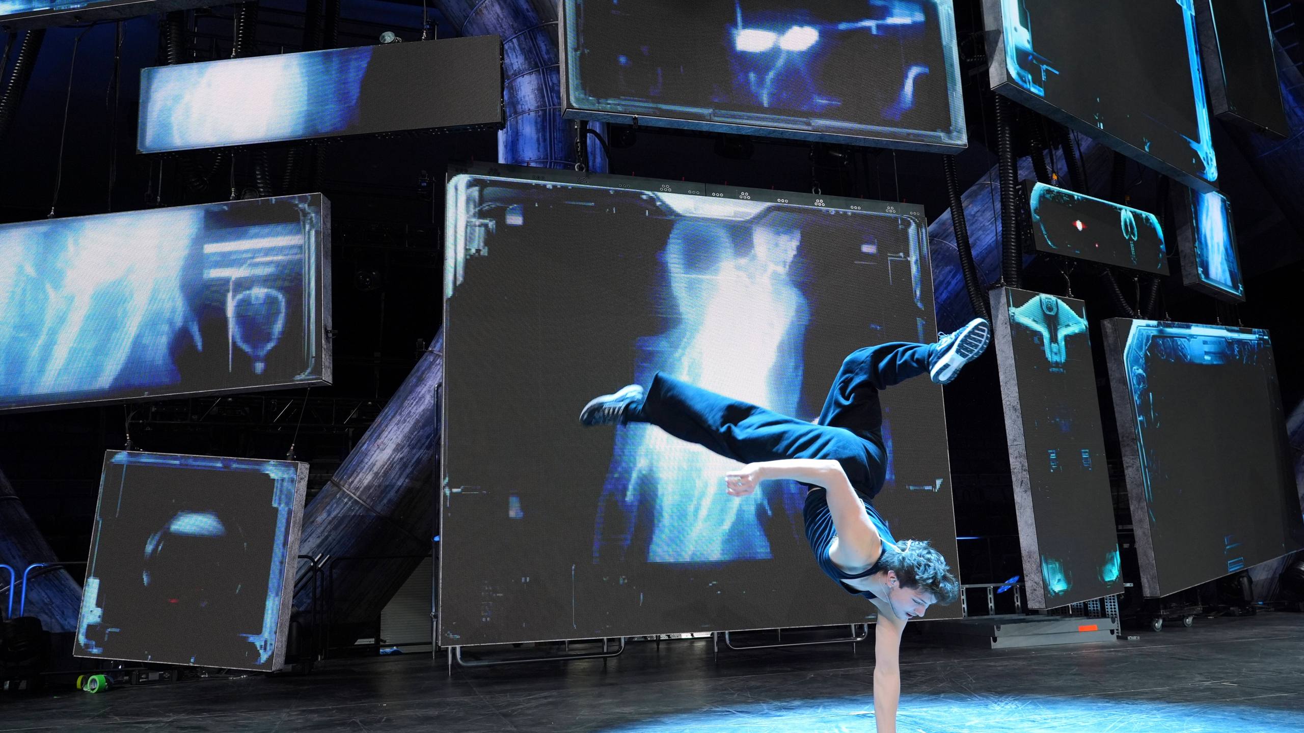 Dancer Diego Pasillas warms up in front of onstage video screens during rehearsals for Katy Perry's "The Lifetimes Tour" at the Toyota Arena on Wednesday, April 9, 2025, in Ontario, Calif. (AP Photo/Chris Pizzello)