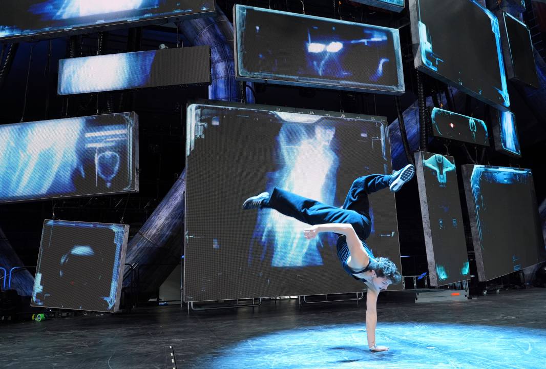 Dancer Diego Pasillas warms up in front of onstage video screens during rehearsals for Katy Perry's "The Lifetimes Tour" at the Toyota Arena on Wednesday, April 9, 2025, in Ontario, Calif. (AP Photo/Chris Pizzello)