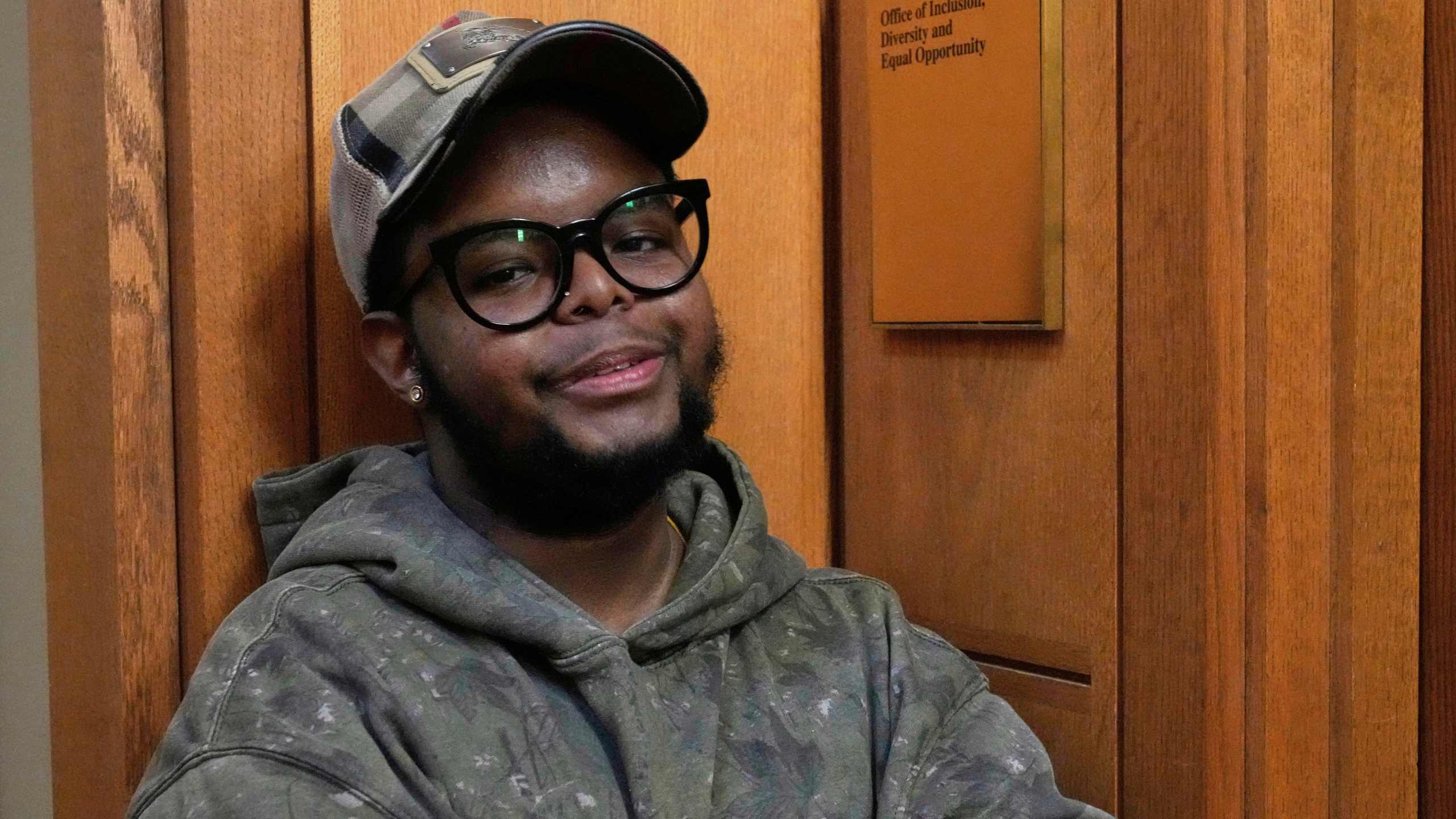 Case Western Reserve University student. Justen Pippens poses for a photo outside the recently closed Office of Inclusion, Diversity and Equal Opportunity at the school In Cleveland Thursday, April 17, 2025. (AP Photo/Sue Ogrocki)