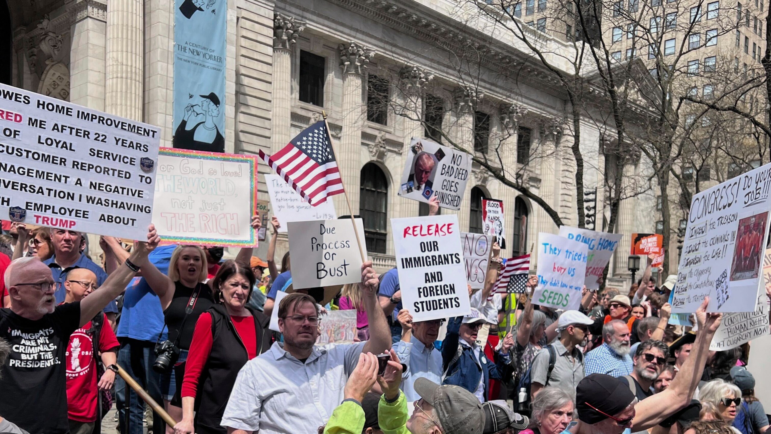 People gather to protest President Donald Trump's policies on Saturday, April 19, 2025 in New York. (AP Photo/Joseph Frederick)