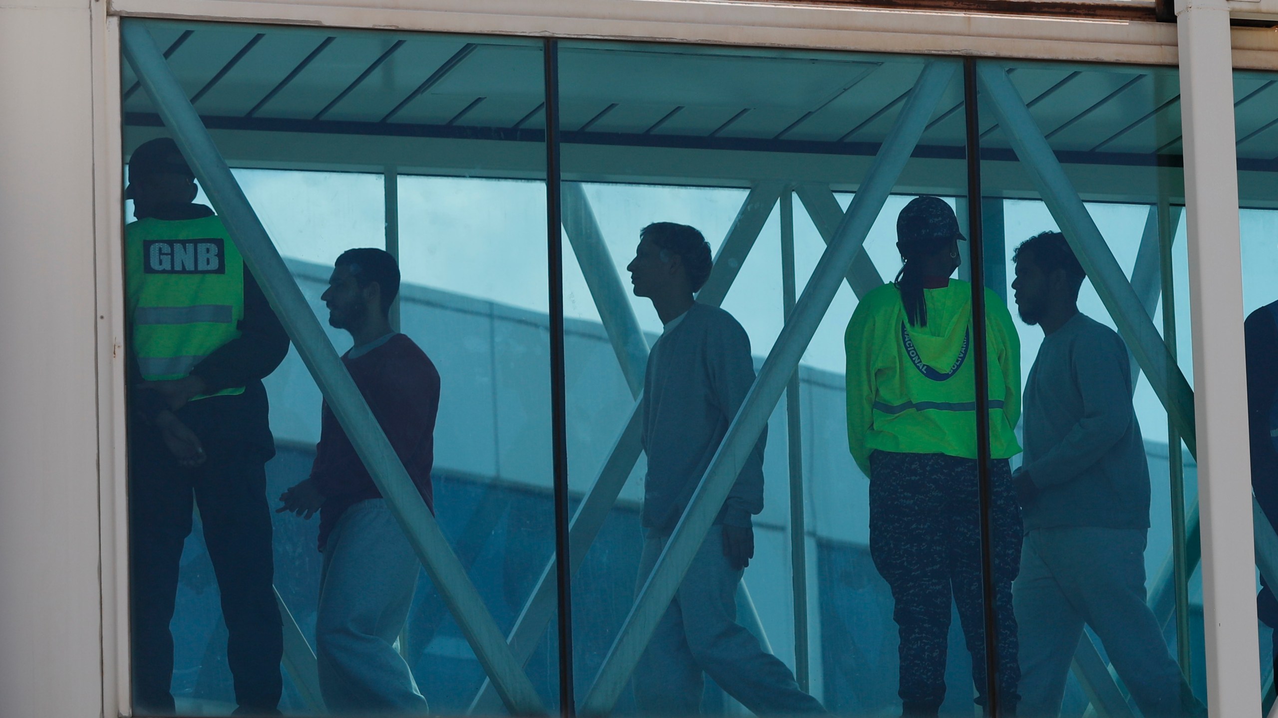 Venezuelan migrants deported from the United States arrive at Simon Bolivar International Airport in Maiquetia, Venezuela, Sunday, March 30, 2025. (AP Photo/Cristian Hernandez)