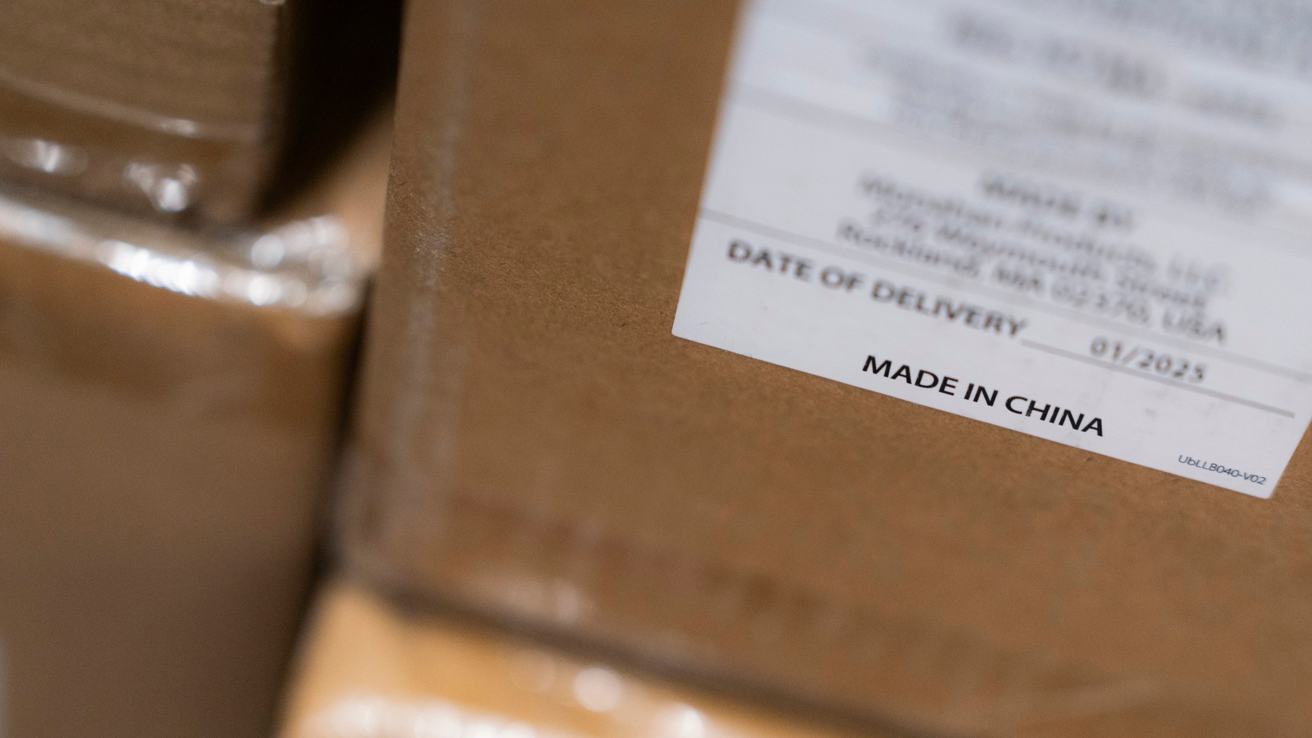 A "Made in China" sticker is seen on inventory at the baby store Three Littles Union Market location in Washington, on Wednesday, April 16, 2025. (AP Photo/Nathan Howard)