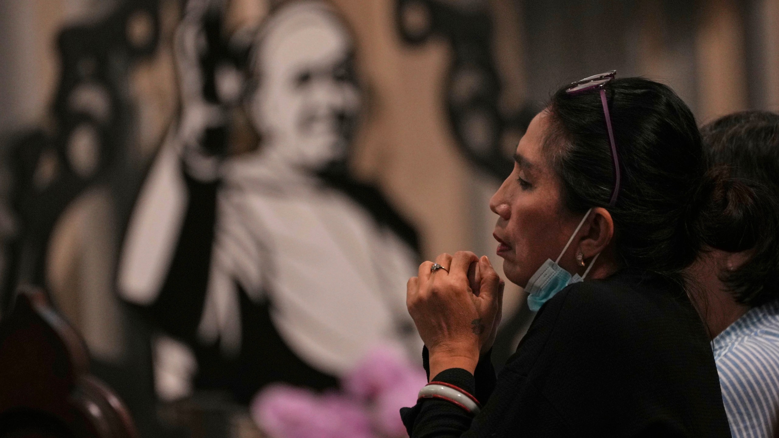 A woman prays during a mass at the Church of Our Lady of the Assumption which visited Pope Francis visited in 2024, in Jakarta, Indonesia, Monday, April 21, 2025. (AP Photo/Achmad Ibrahim)