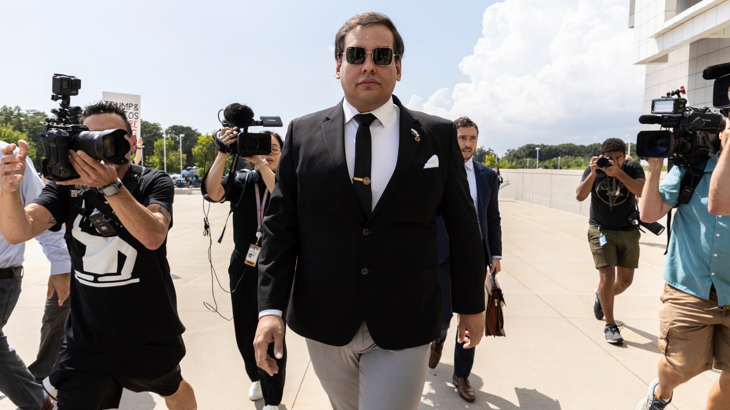 FILE - Former U.S. Rep. George Santos arrives at court in Central Islip, N.Y., Aug. 19, 2024. (AP Photo/Stefan Jeremiah, File)