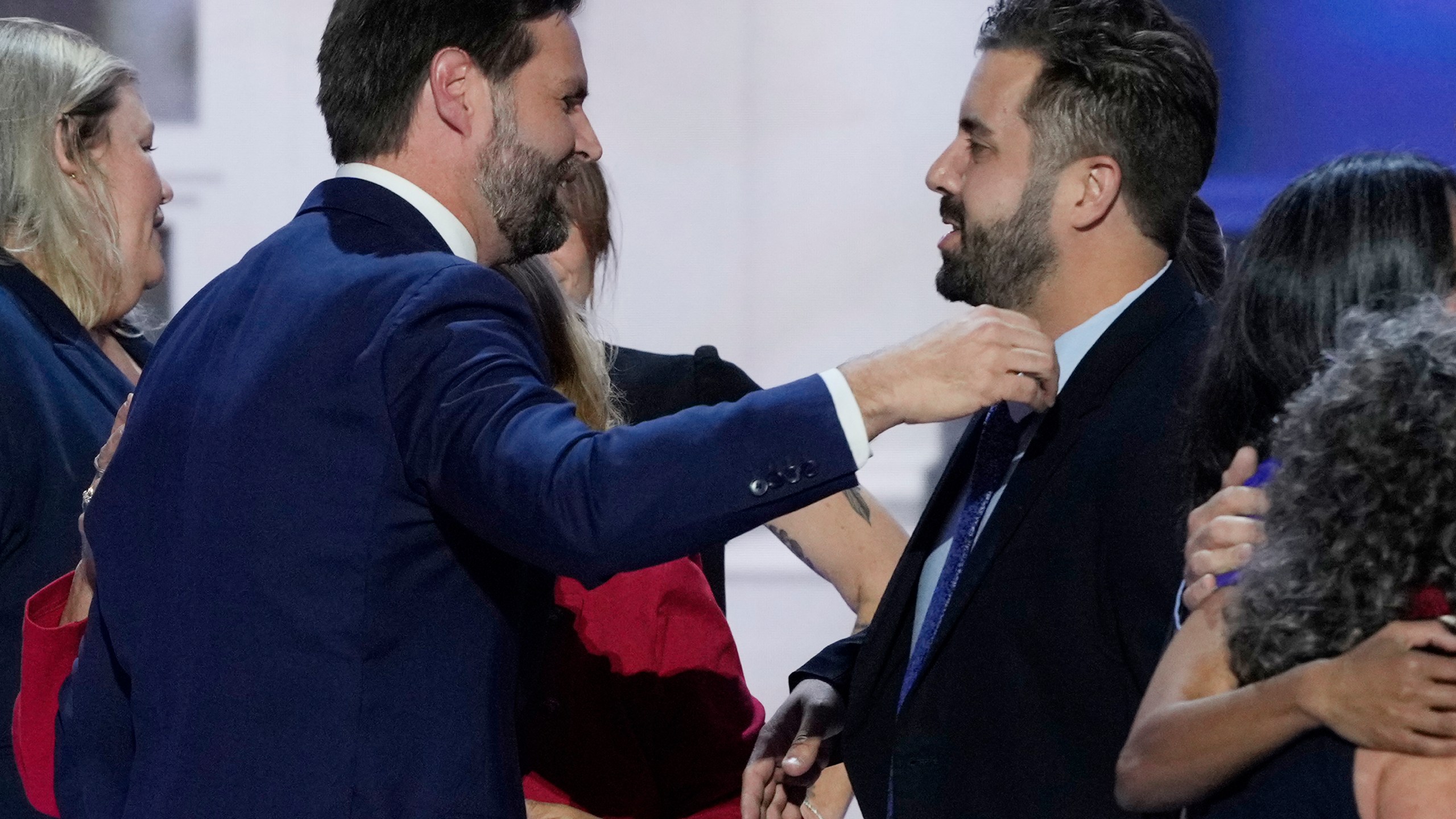 Cory Bowman, half-brother of Republican vice presidential candidate Sen. JD Vance, R-Ohio, right, hugs Vance during the Republican National Convention, Wednesday, July 17, 2024, in Milwaukee. (AP Photo/J. Scott Applewhite)