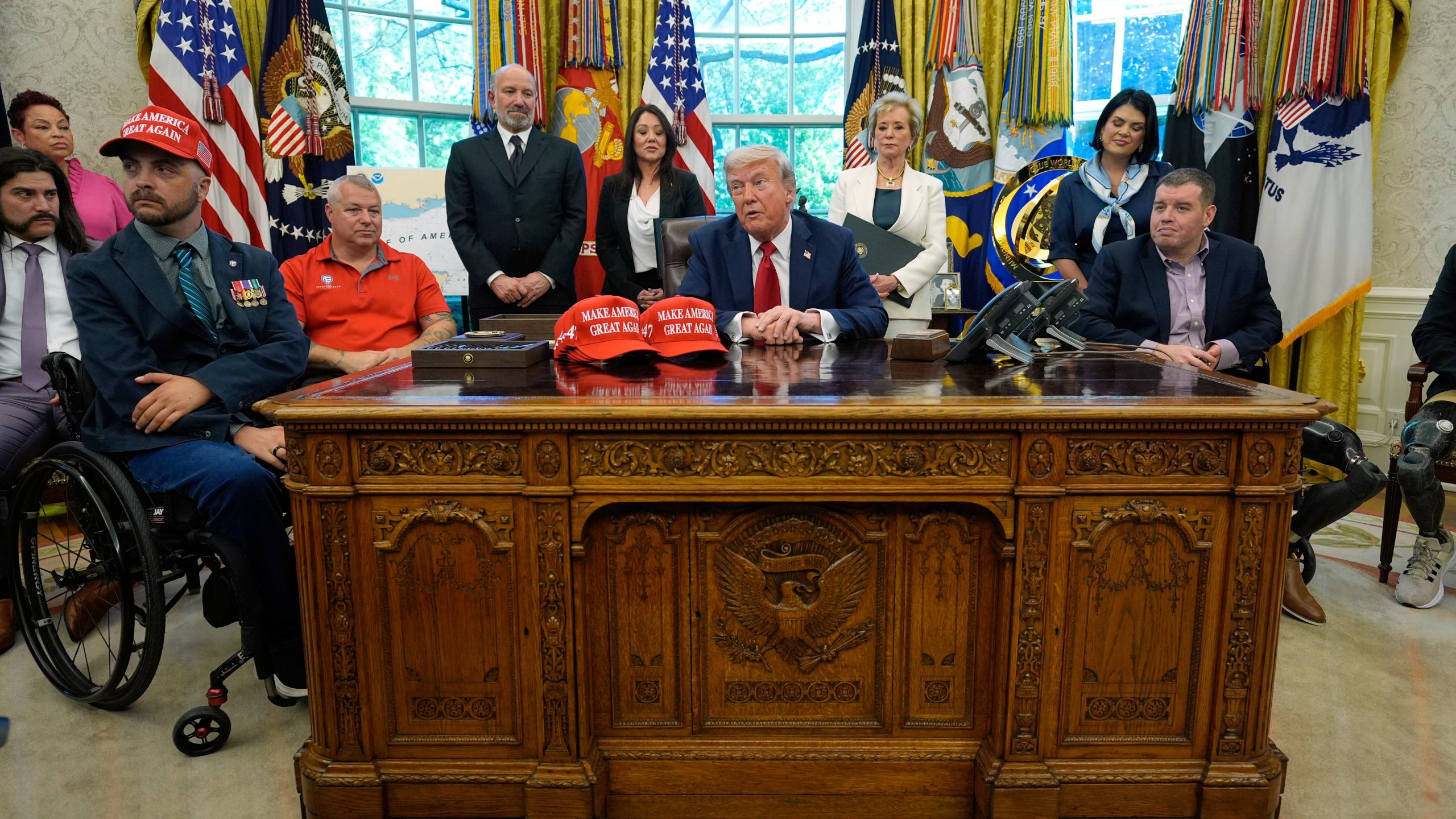 President Donald Trump speaks with reporters after signing executive orders in the Oval Office of the White House, Wednesday, April 23, 2025, in Washington. (AP Photo/Alex Brandon)