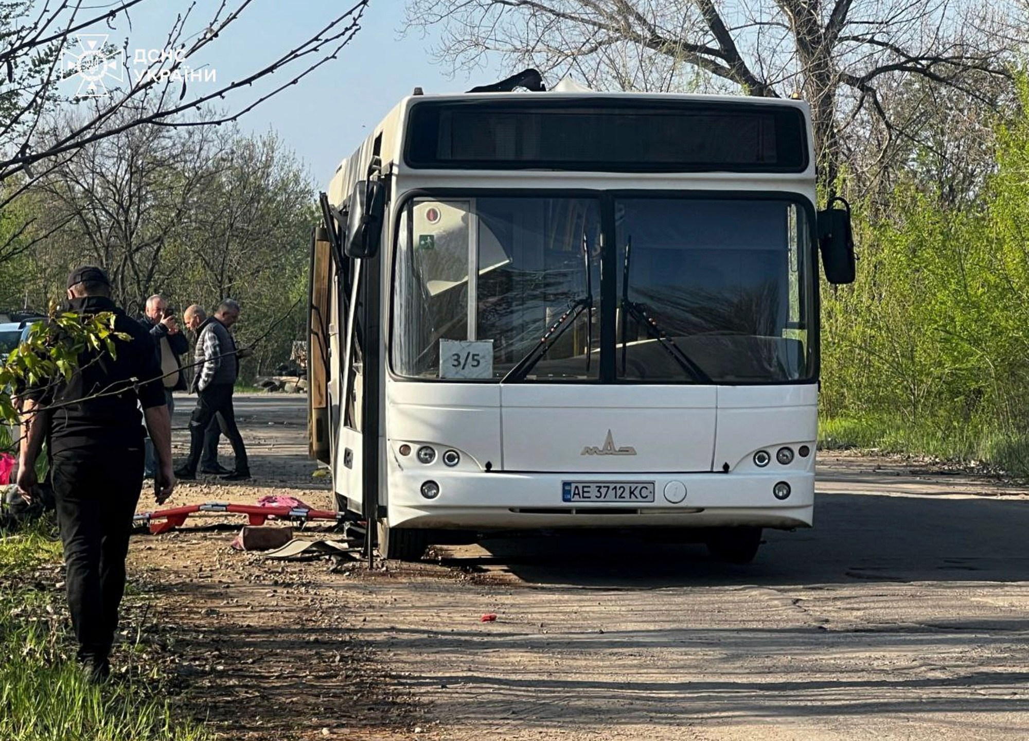 In this photo provided by the Ukrainian Emergency Service, a damaged bus that was hit by the Russian drone in Marhanets, Dnipropetrovsk region, Wednesday, April 23, 2025. (Ukrainian Emergency Service via AP)