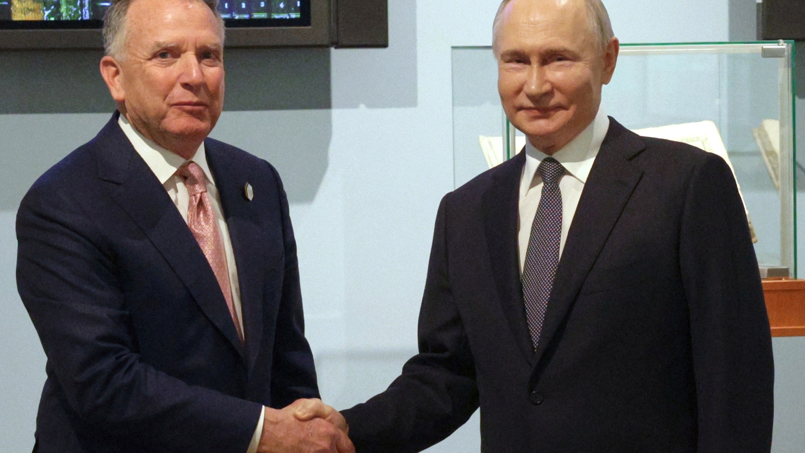 Russian President Vladimir Putin, right, and U.S. President Donald Trump's special envoy Steve Witkoff shake hands prior to their talks in St. Petersburg, Russia, Friday, April 11, 2025. (Gavriil Grigorov, Sputnik, Kremlin Pool Photo via AP)