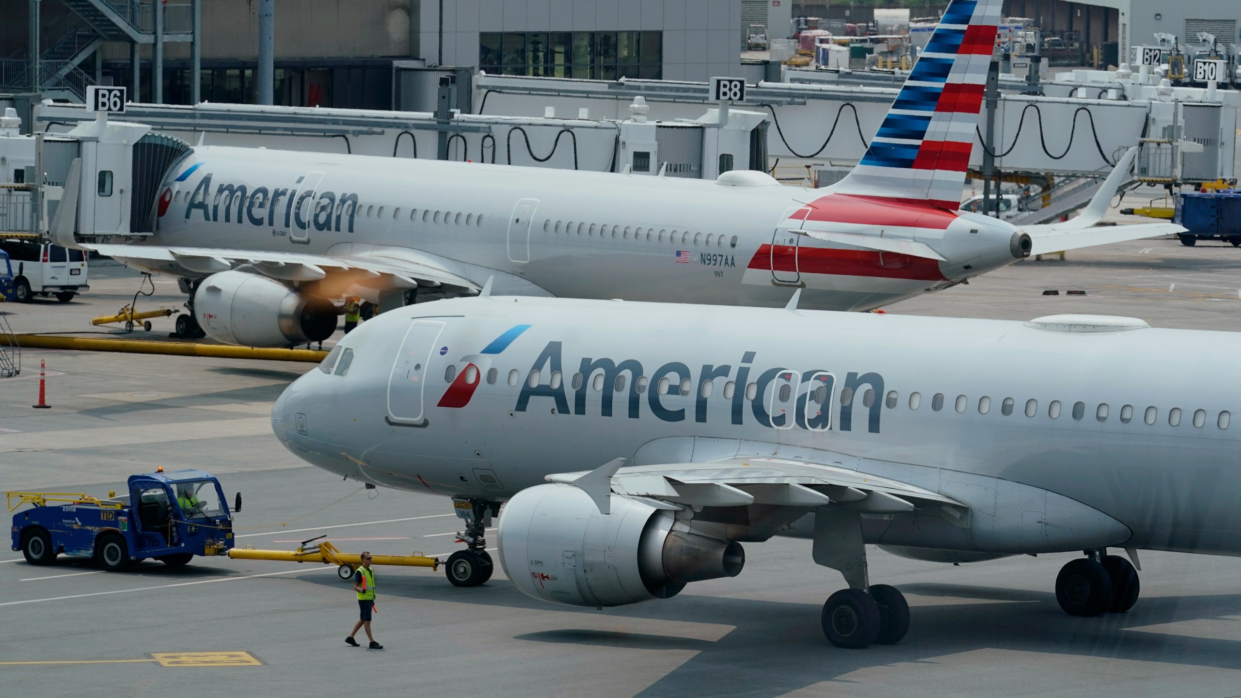 American Airlines passenger jets prepare for departure