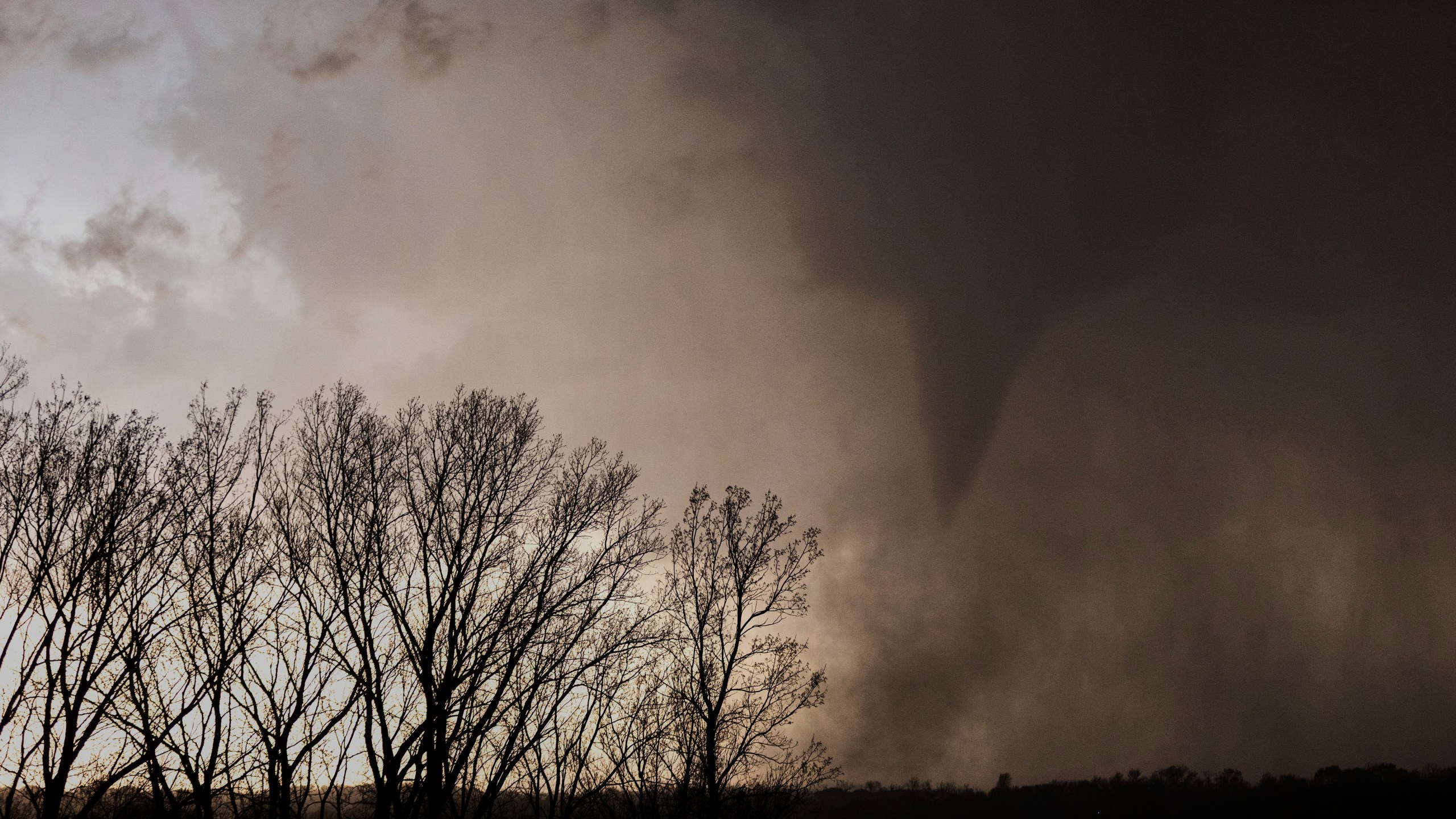 A tornado is seen from afar