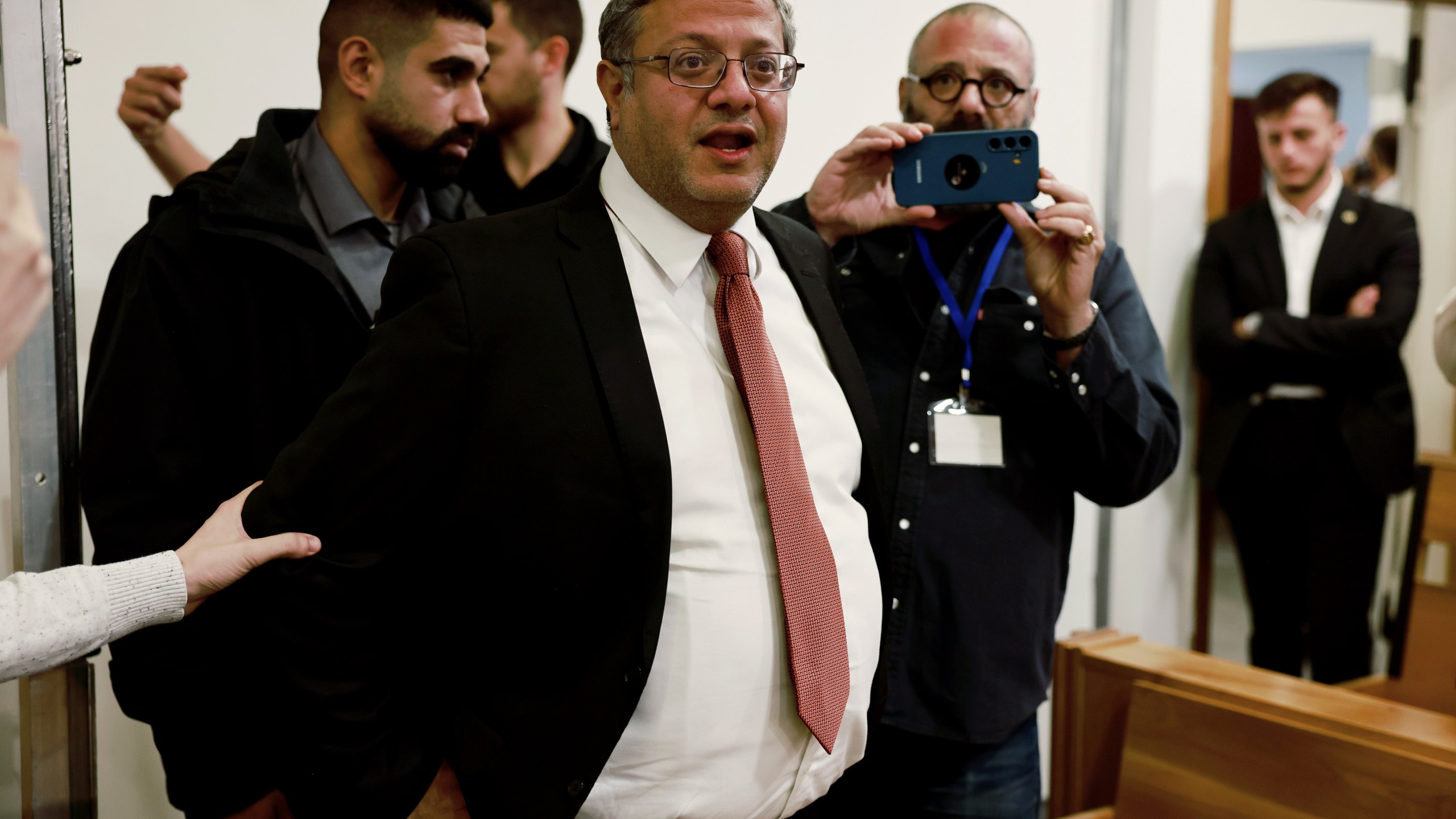 FILE - Israel's National Security Minister Itamar Ben Gvir, center, addresses the media as he enters a courtroom in Tel Aviv before the start of Prime Minister Benjamin Netanyahu's hearing Tuesday, Dec. 10, 2024. (Menahem Kahana/Pool Photo via AP, File)