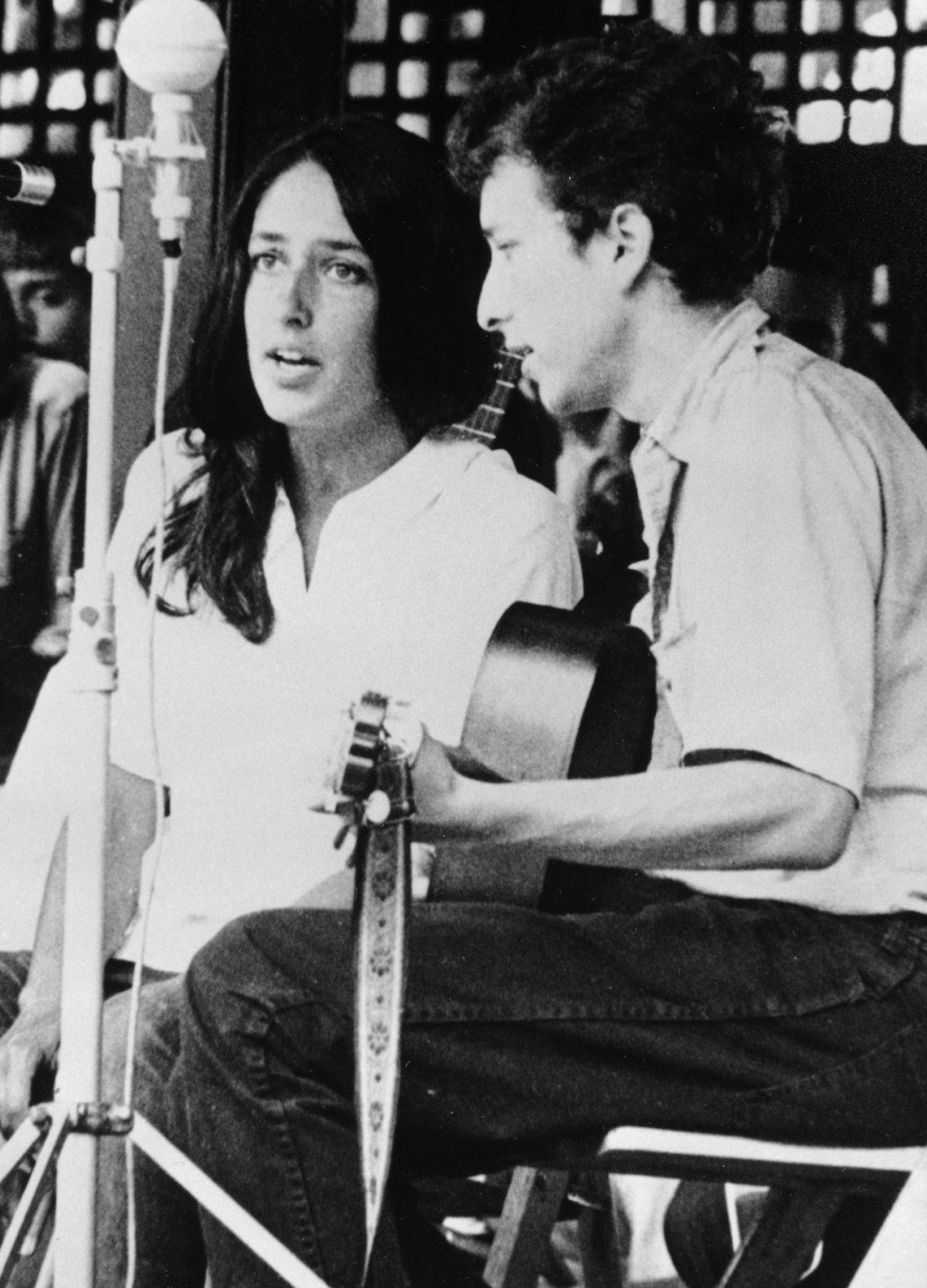 FILE - In this 1963 file photo, Joan Baez and Bob Dylan perform at the Newport Jazz Festival in Newport, R.I. Two years later, on the night of July 25, 1965, Dylan strode onto a stage at the Newport Folk Festival, plugged in an electric guitar and gave the music world a shock. Fifty years later, it's considered one of the most important events in rock history, the high-voltage moment when Dylan broke from folk and helped show his fellow musicians the poetic possibilities of rock. (AP Photo, File)
