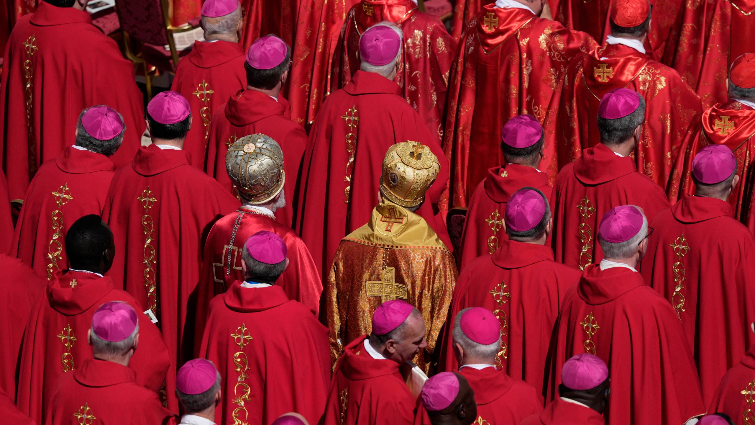 Cardinals stand during the funeral of Pope Francis in St. Peter's Square at the Vatican, Saturday, April 26, 2025. (AP Photo/Gregorio Borgia)