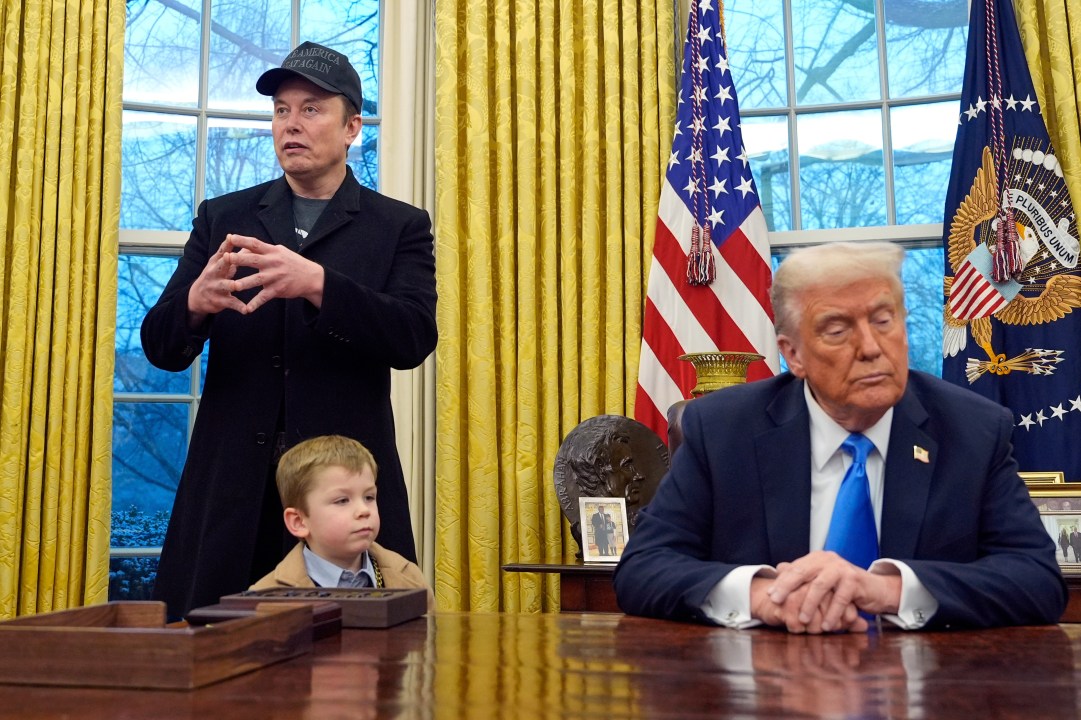FILE - President Donald Trump listens as Elon Musk, joined by his son X Æ A-Xii, speaks in the Oval Office at the White House, Feb. 11, 2025, in Washington. (AP Photo/Alex Brandon, File)